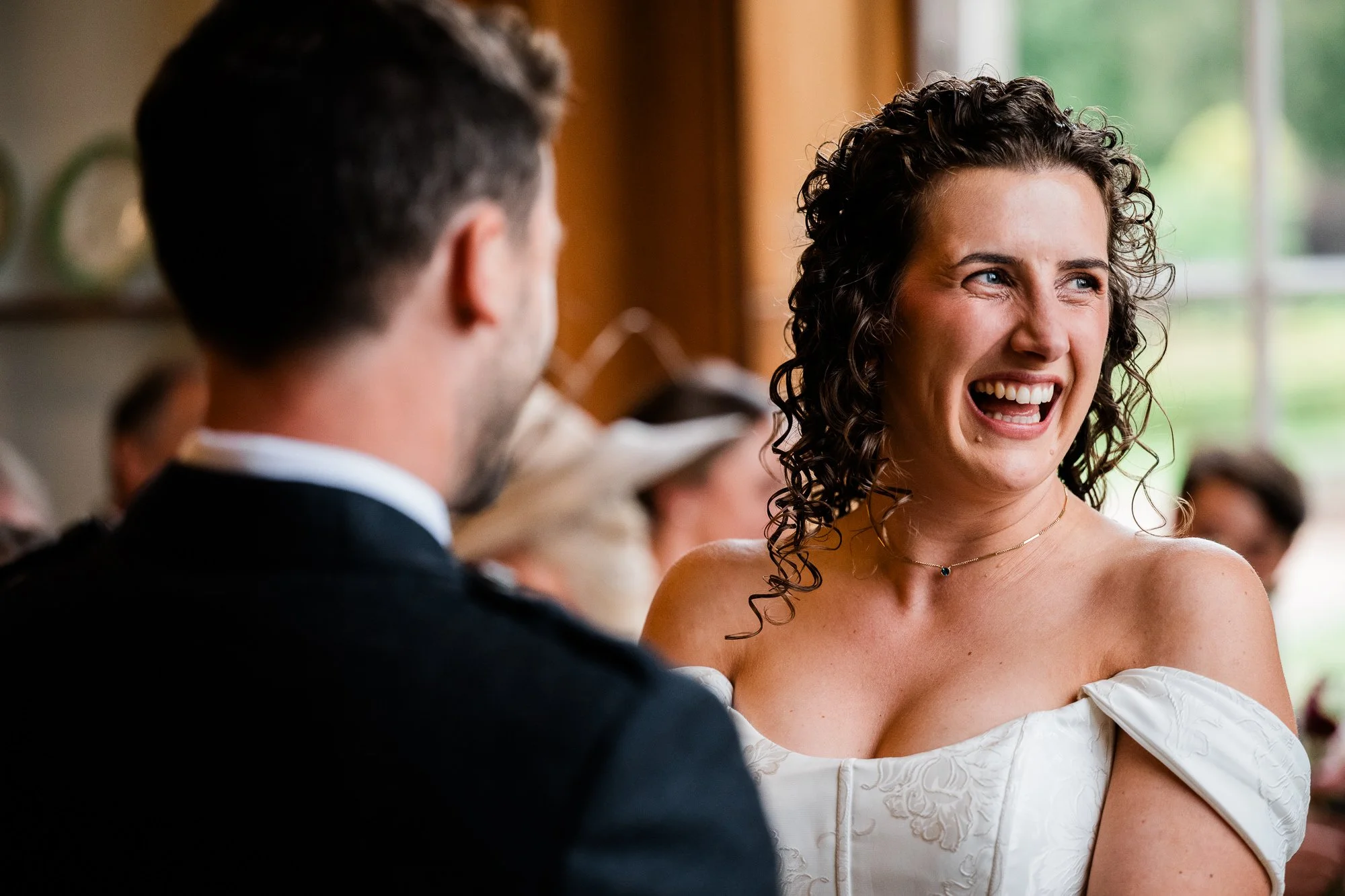 Aimee laughs with Matthew during the wedding ceremony.