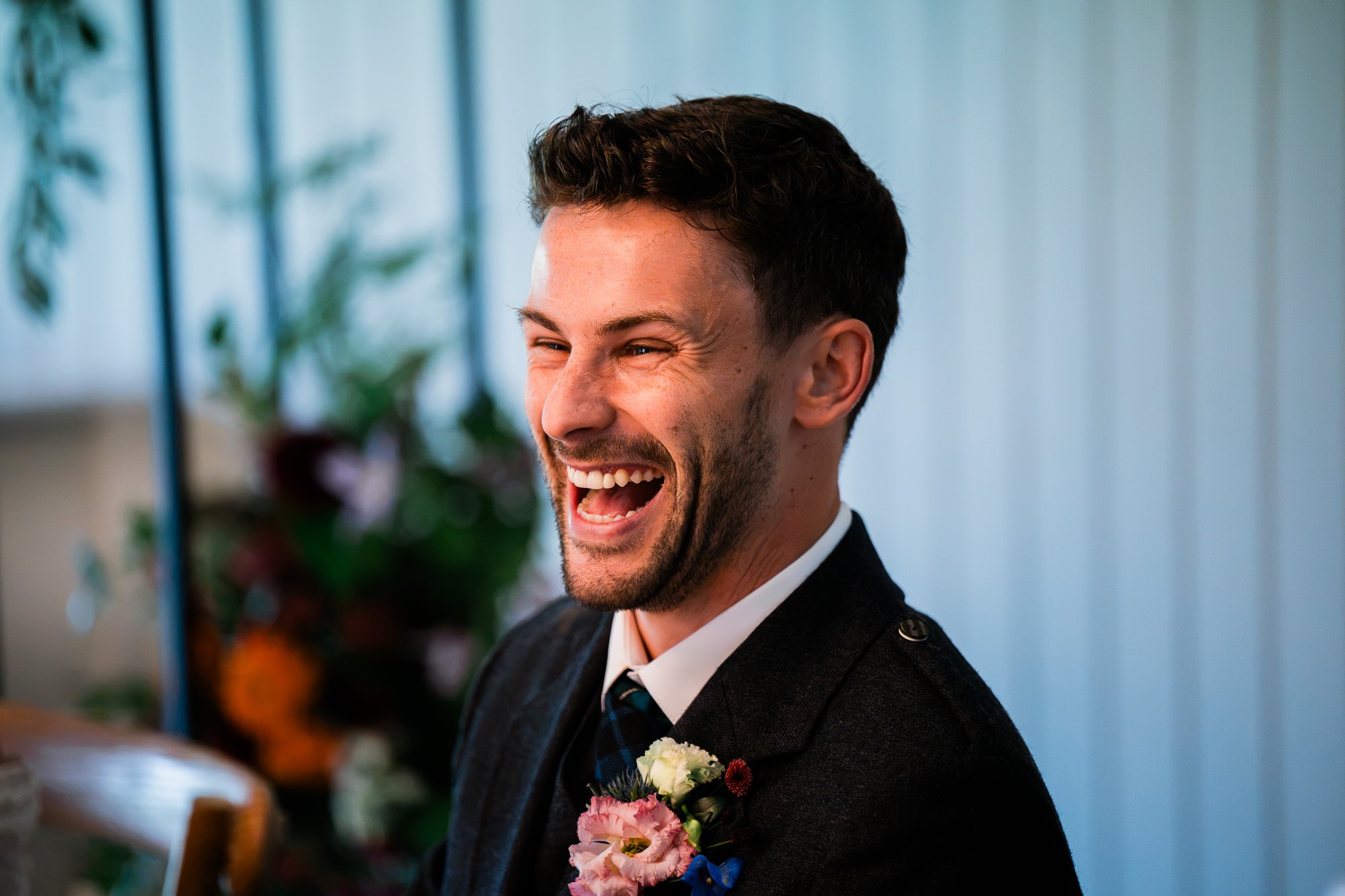 Matthew laughs during the wedding reception speeches.