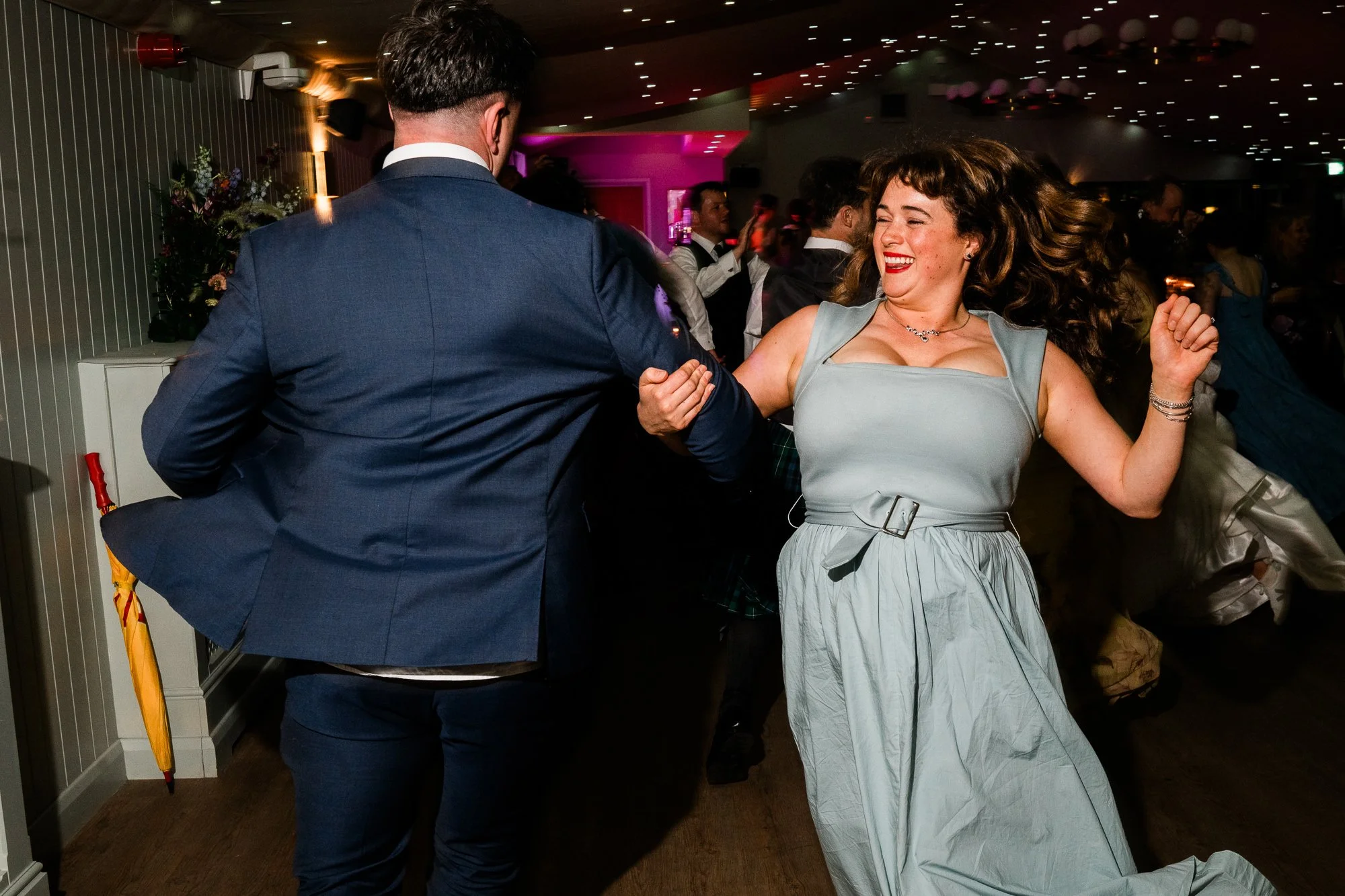 Wedding guests dance together at Aimee and Matthew’s evening celebration.