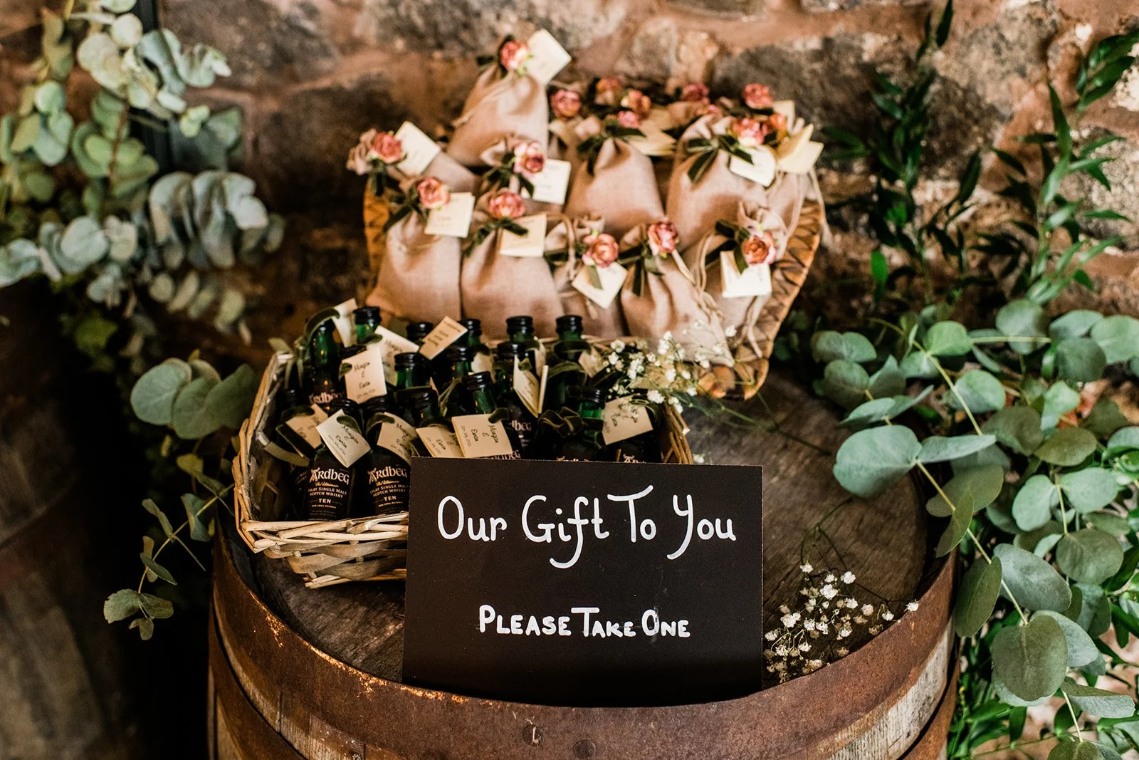 A basket of confetti cones surrounded by dried flowers and foliage.