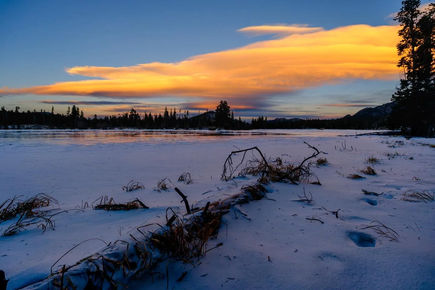 Lenticular clouds and sunset, all while getting leveled by the wind.  Good times in @rockynps at Sprague Lake.  #frozenlake #sunset #mountainwave #windy