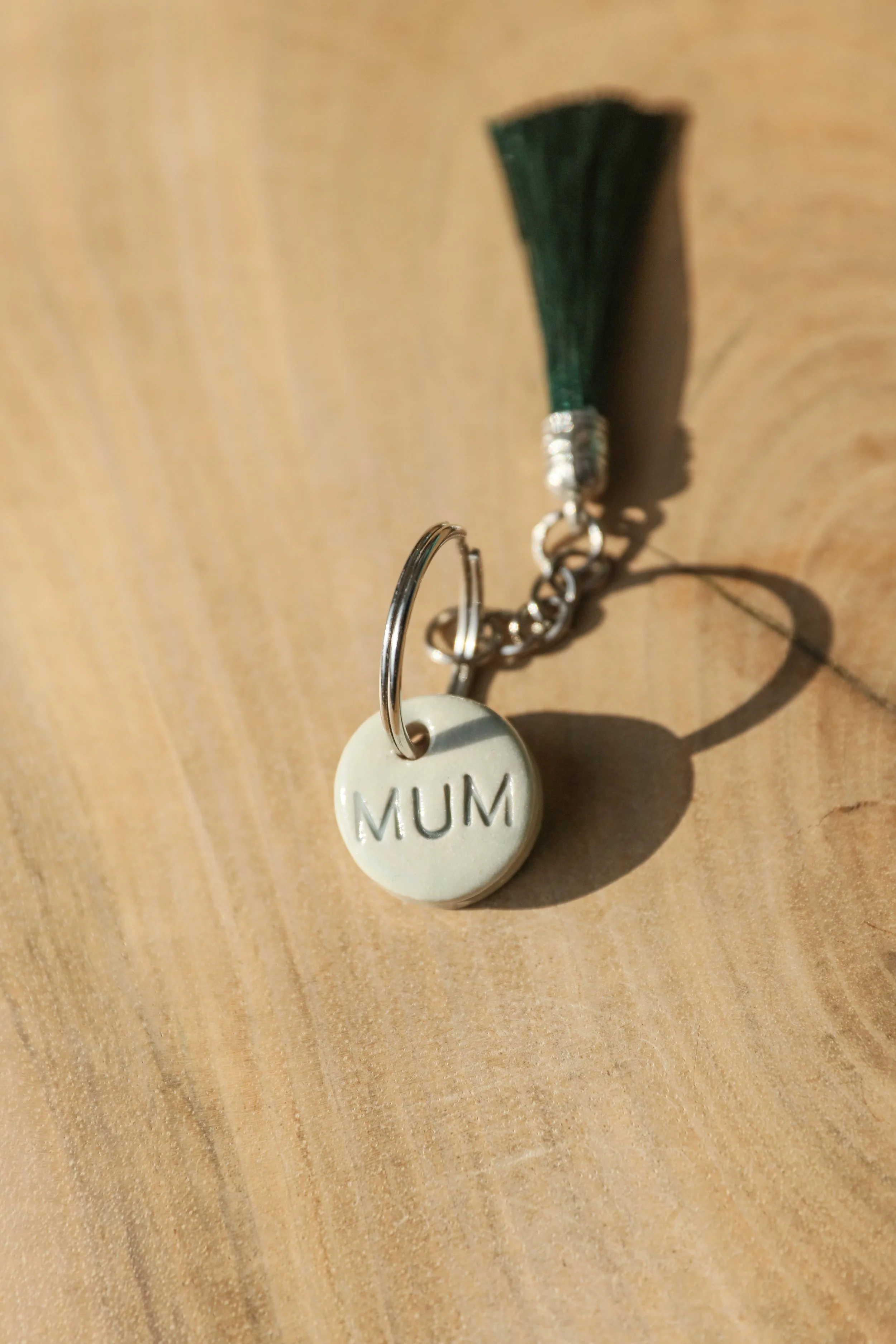 Donna's Clay keyrings. Available in cream or aqua bases with either black or grey writing. These can be personalised with names too, but ,maximum of 4 letters. They are approx 2.5cm diameter. Everyone loves the feel of these, they are chunky but love