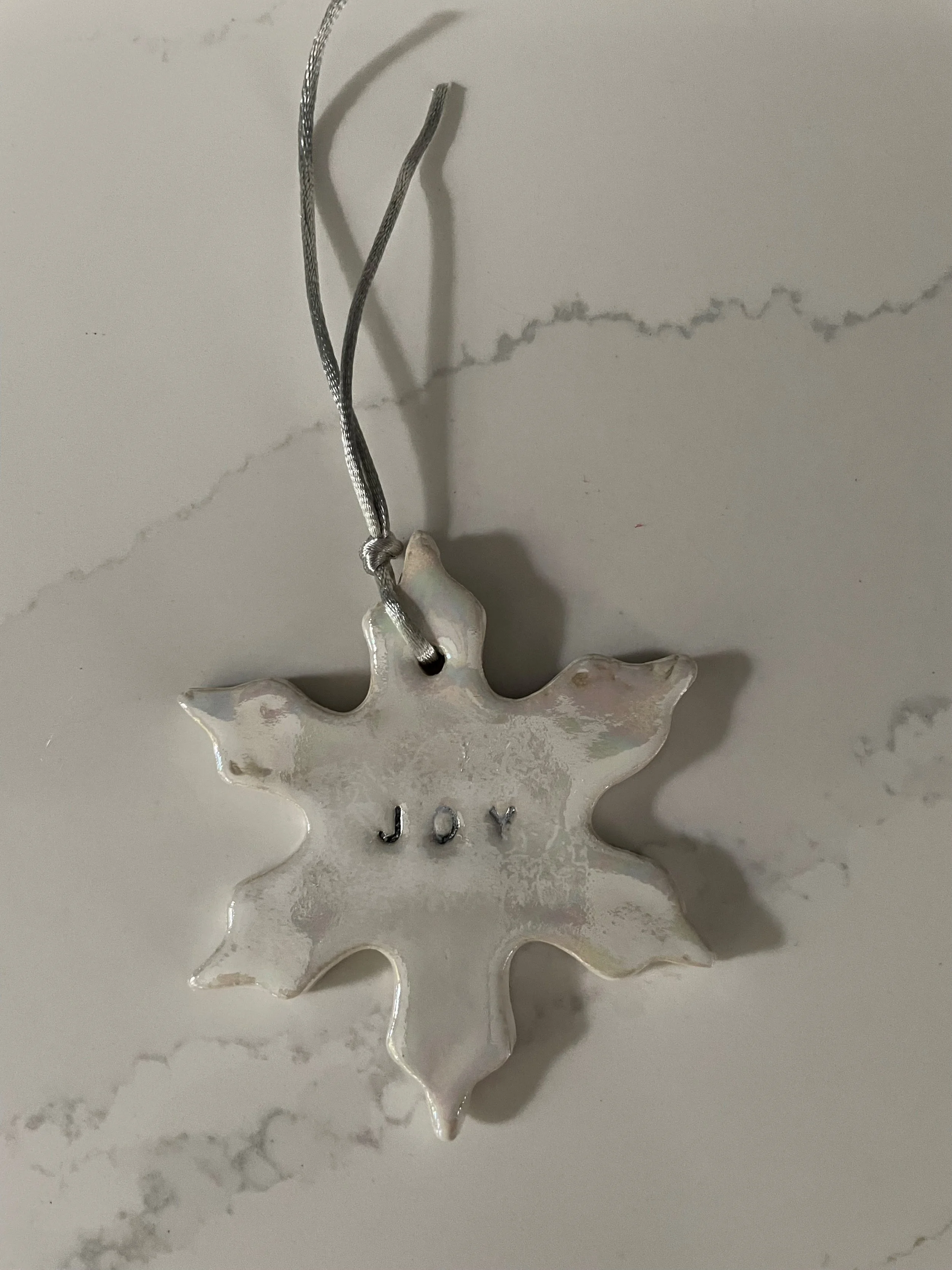 Commission me to make a Christmas clay decoration. These can be personalised with names on. This one says "Joy"