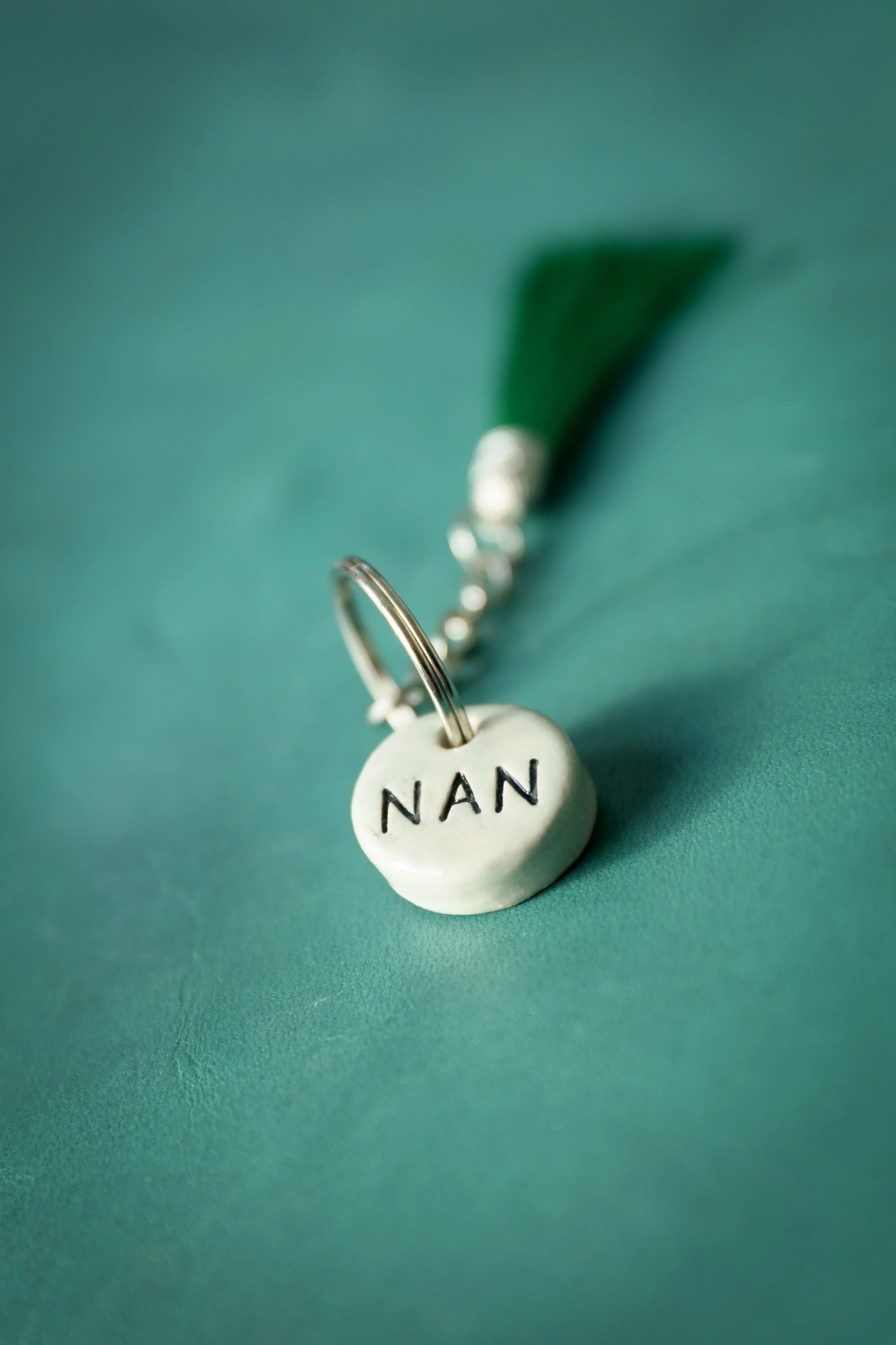 Donna's Clay keyrings. Available in cream or aqua bases with either black or grey writing. These can be personalised with names too, but ,maximum of 4 letters. They are approx 2.5cm diameter. Everyone loves the feel of these, they are chunky but love