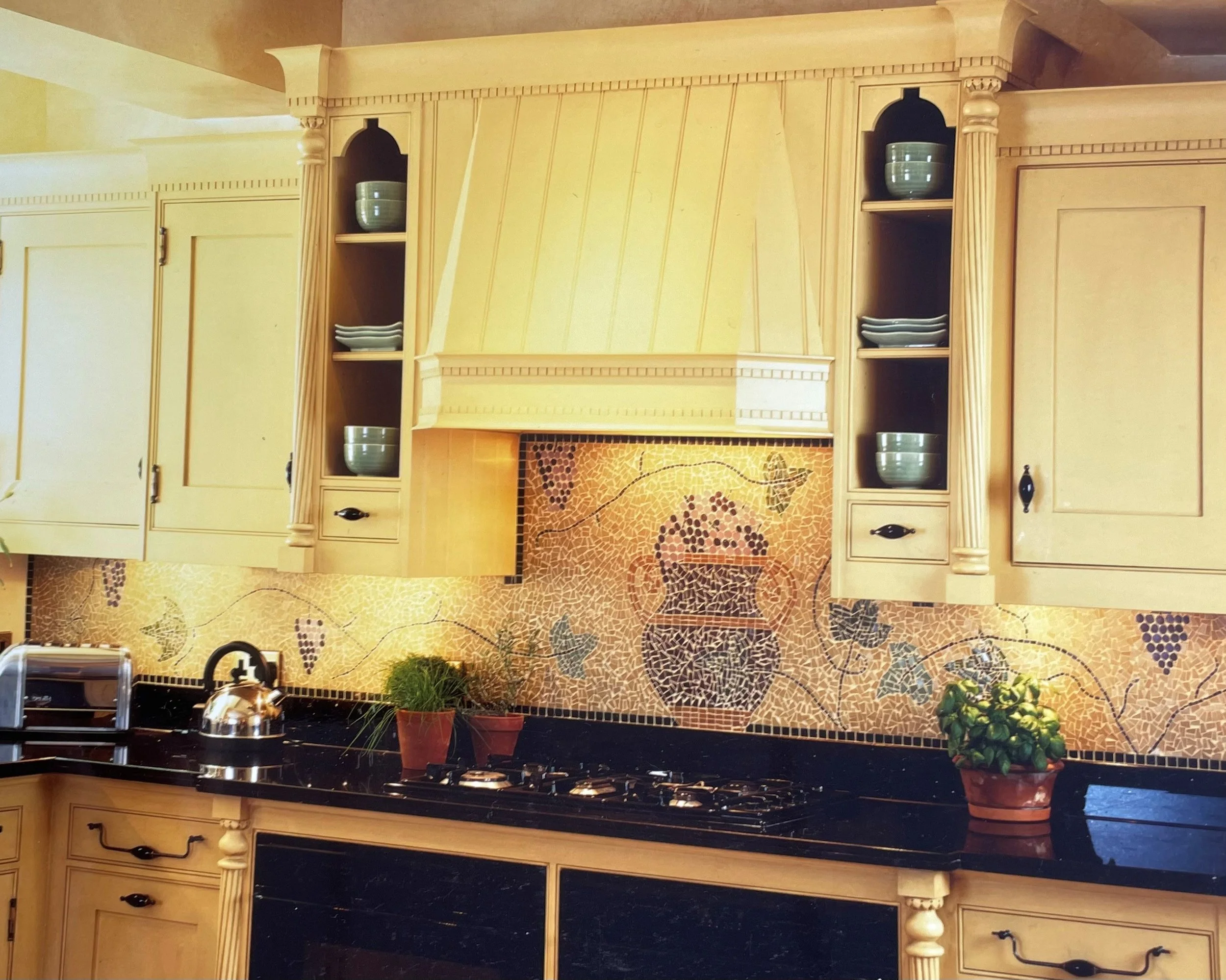 Handmade mosaic for kitchen splashback and hob area of Urn, grapes and leaves, New York.