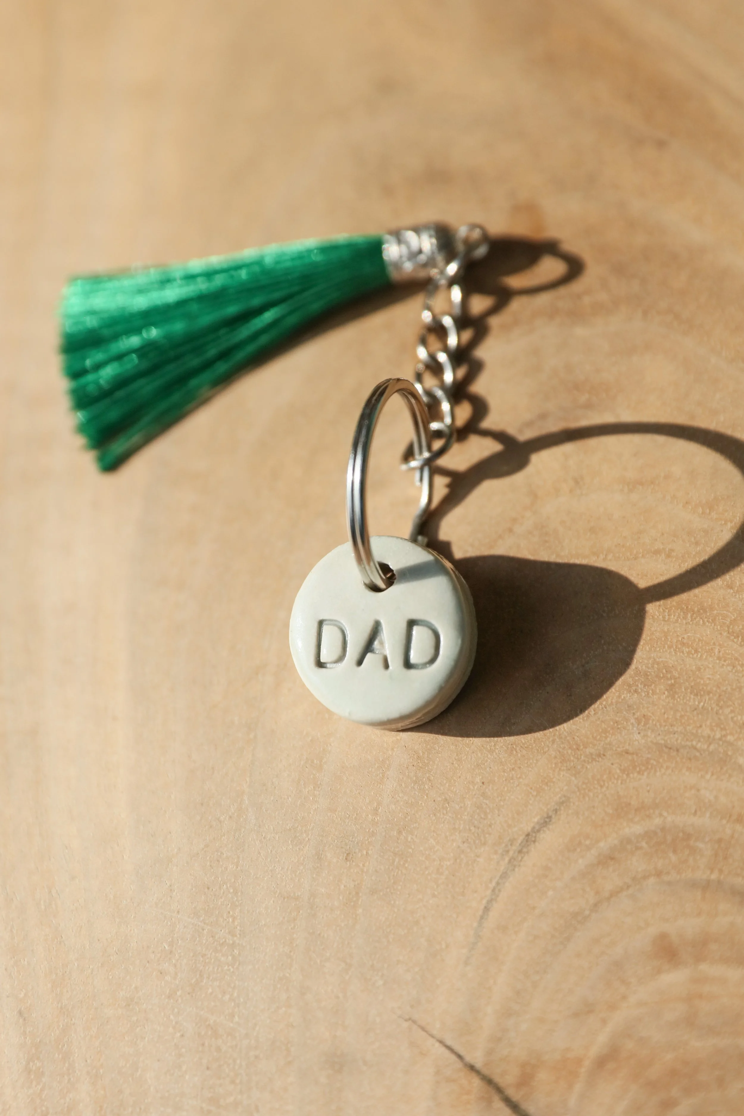 Donna's Clay keyrings. Available in cream or aqua bases with either black or grey writing. These can be personalised with names too, but ,maximum of 4 letters. They are approx 2.5cm diameter. Everyone loves the feel of these, they are chunky but love
