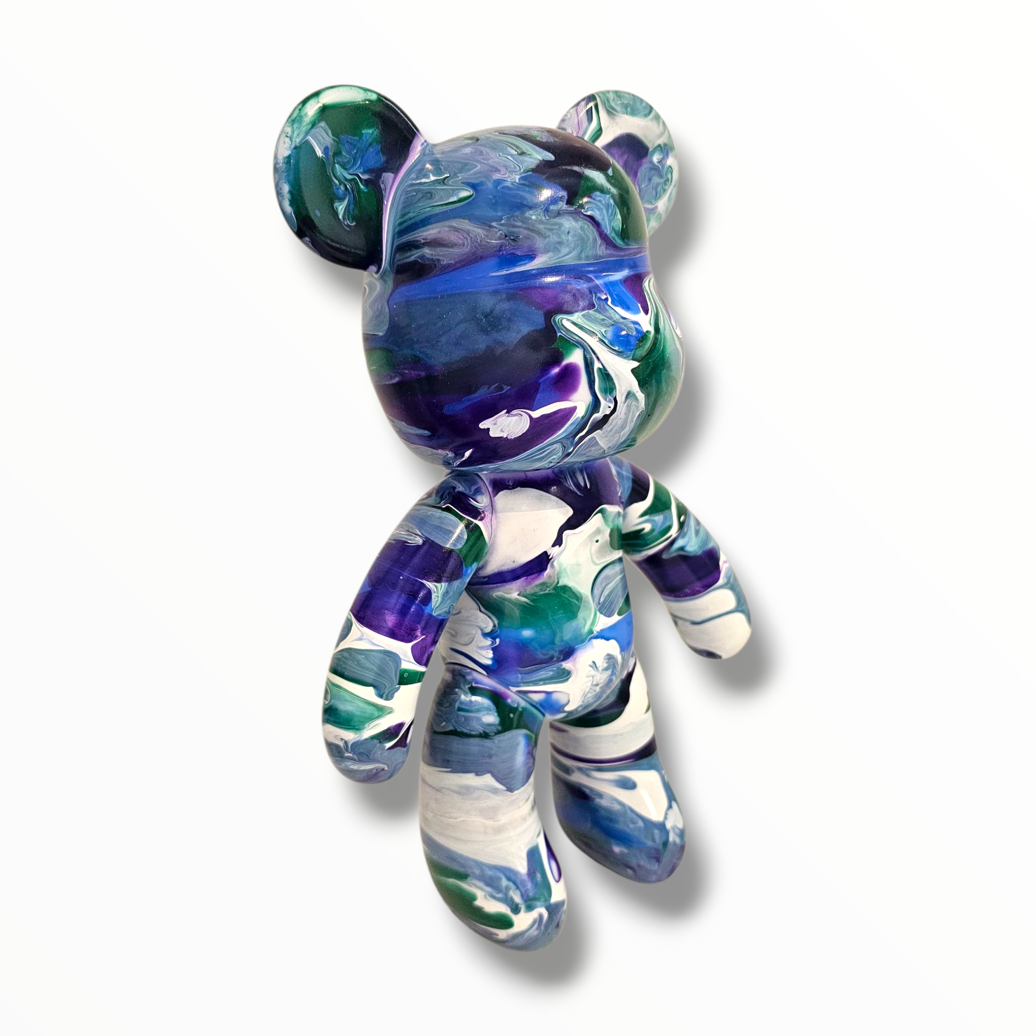 blue and white paint pour on teddy.png