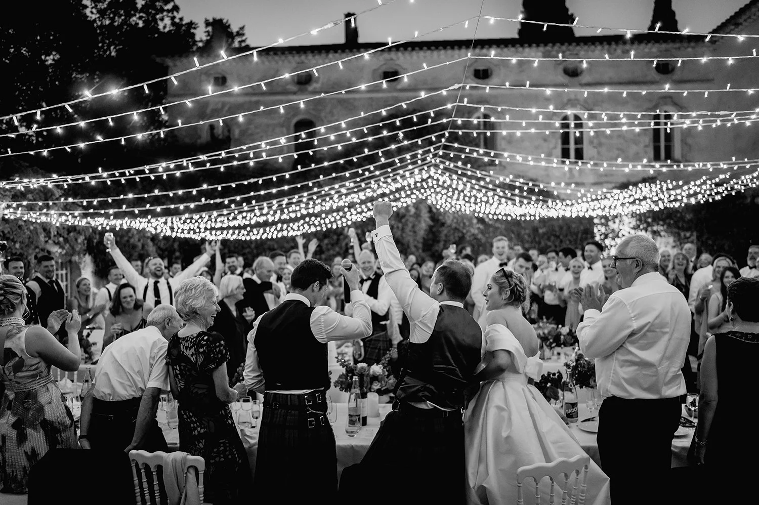 Wedding guests celebrating during a live music performance at Château Robernier in the South of France, capturing the energy and inspiration of a luxury French Riviera wedding event.