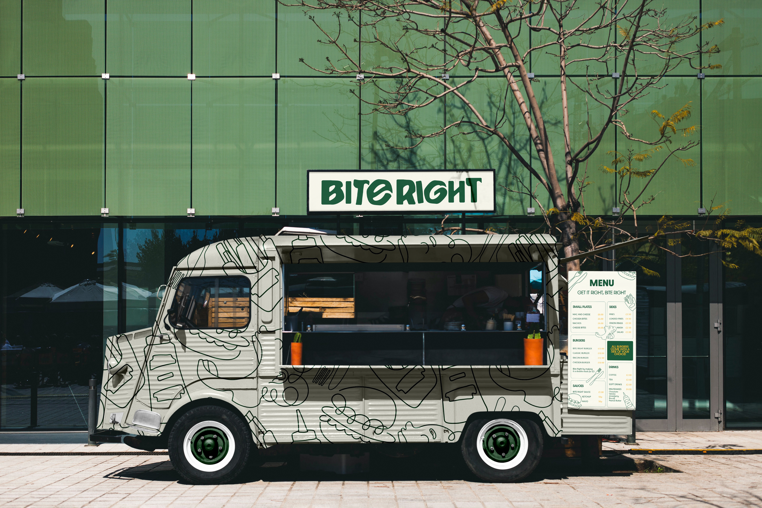 A food truck with a black and white line drawing pattern parked in front of a modern green building with a sign that reads 'BITE RIGHT'. The truck has a menu display on the side, two orange planters, and is partially covered by a leafless tree.