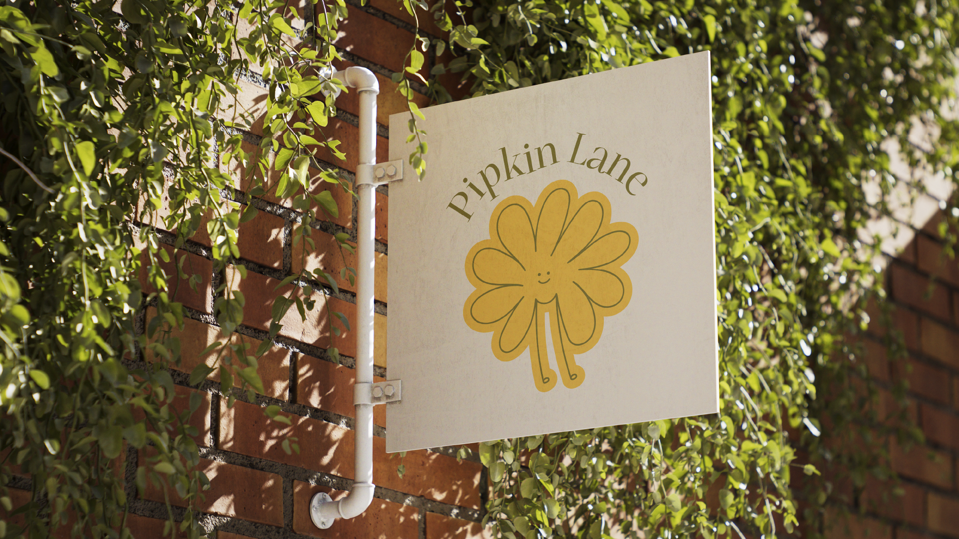 Sign for Pipkin Lane with a smiling flower illustration, mounted on a brick wall surrounded by green foliage.