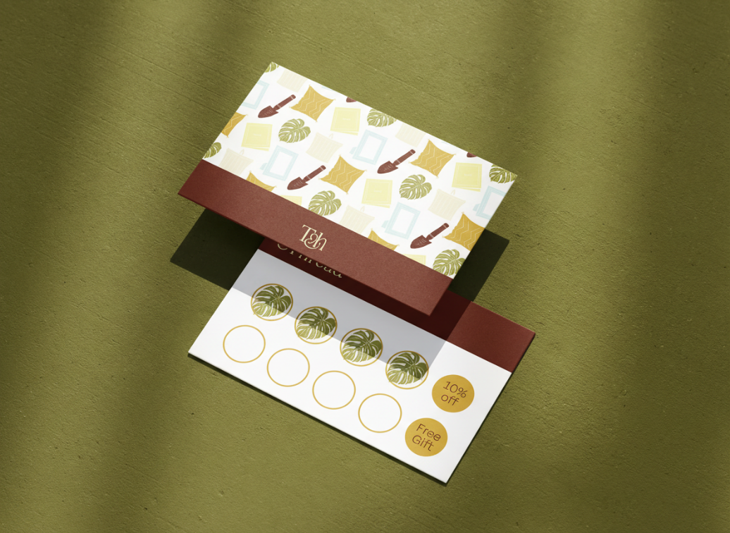 A promotional card with a tropical theme, featuring palm trees, picture frames, and leaves. The card offers a 10% discount and a free gift.