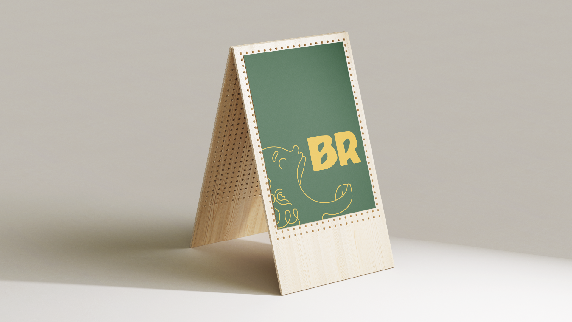 Wooden A-frame sign with a green background displaying a minimal line drawing of a bear and the letters 'BR' in bold yellow.