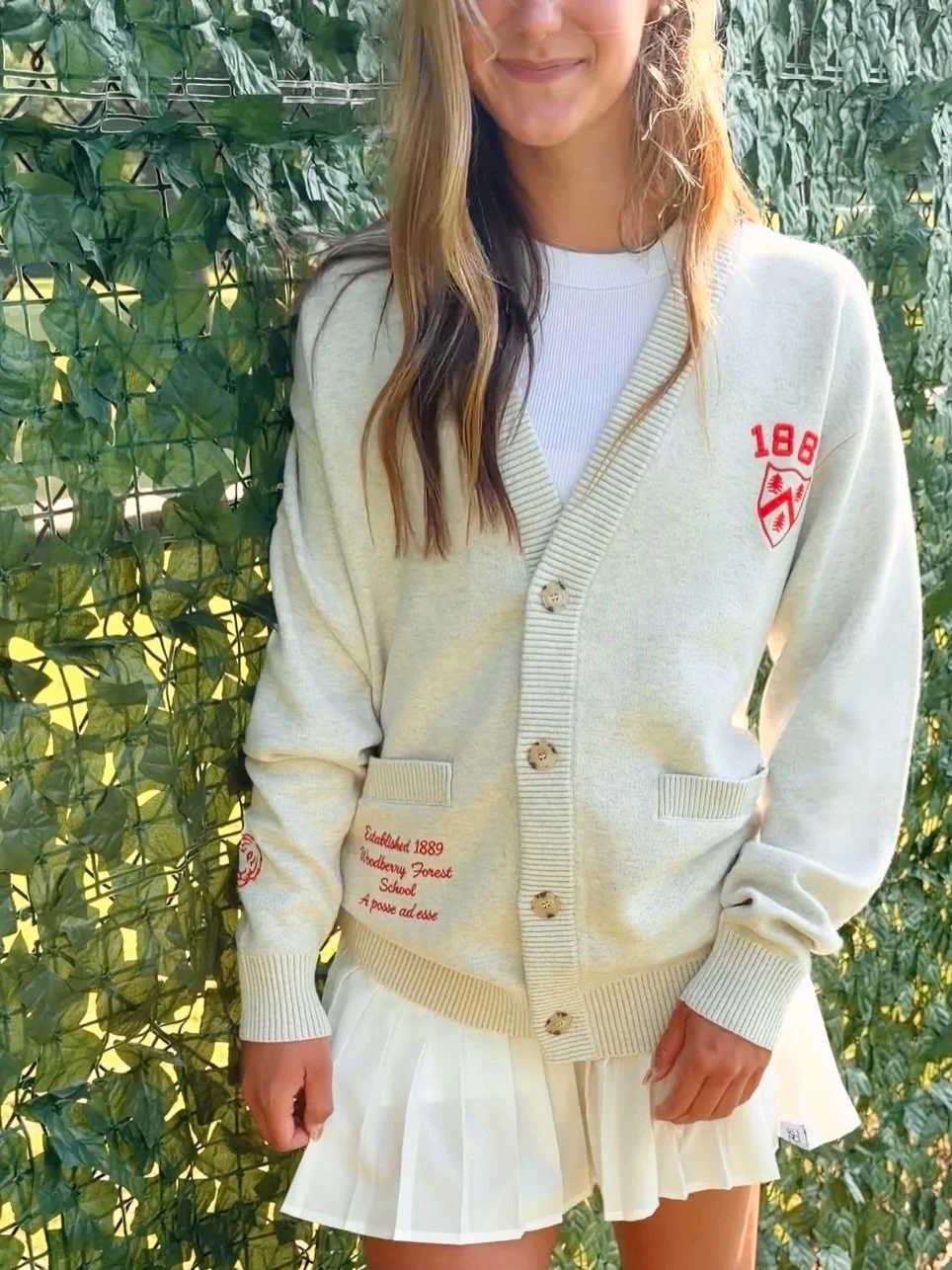 Meet the Varsity Cardigan &mdash; a newer product from Spirit Collective. Features include a 3D embroidery at the chest, additional embroidered details on the sleeve, and the option to customize with a school founding date or slogan beneath the pocke
