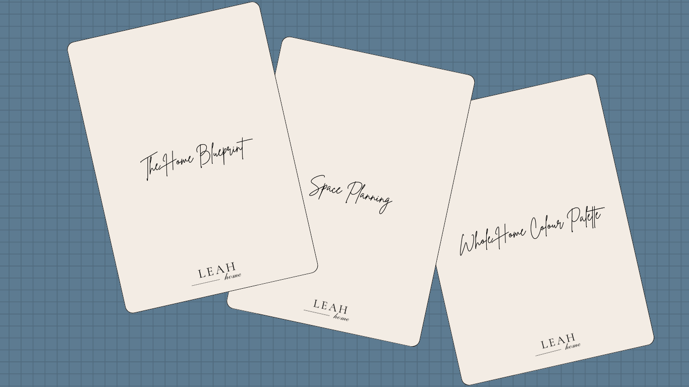 Three cards with different home design project titles: 'The Home Blueprint,' 'Space Planning,' and 'Whole Home Colour Palette,' all labeled with 'LEAH home' at the bottom, spread on a blue grid surface.