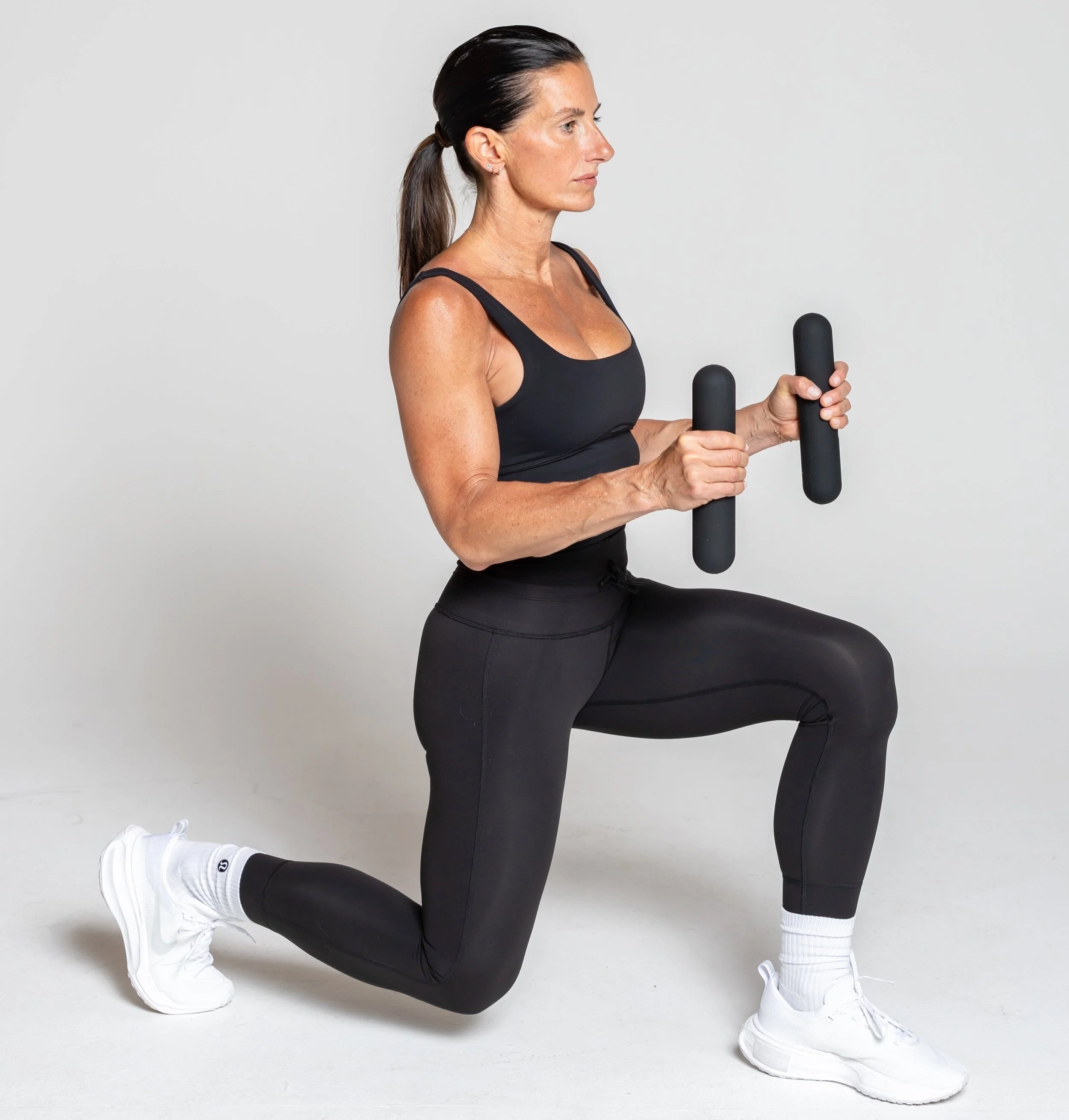 Reverse Lunges- Hold bars either by side or bent elbows, step foot back to lower to 90 degree angle.