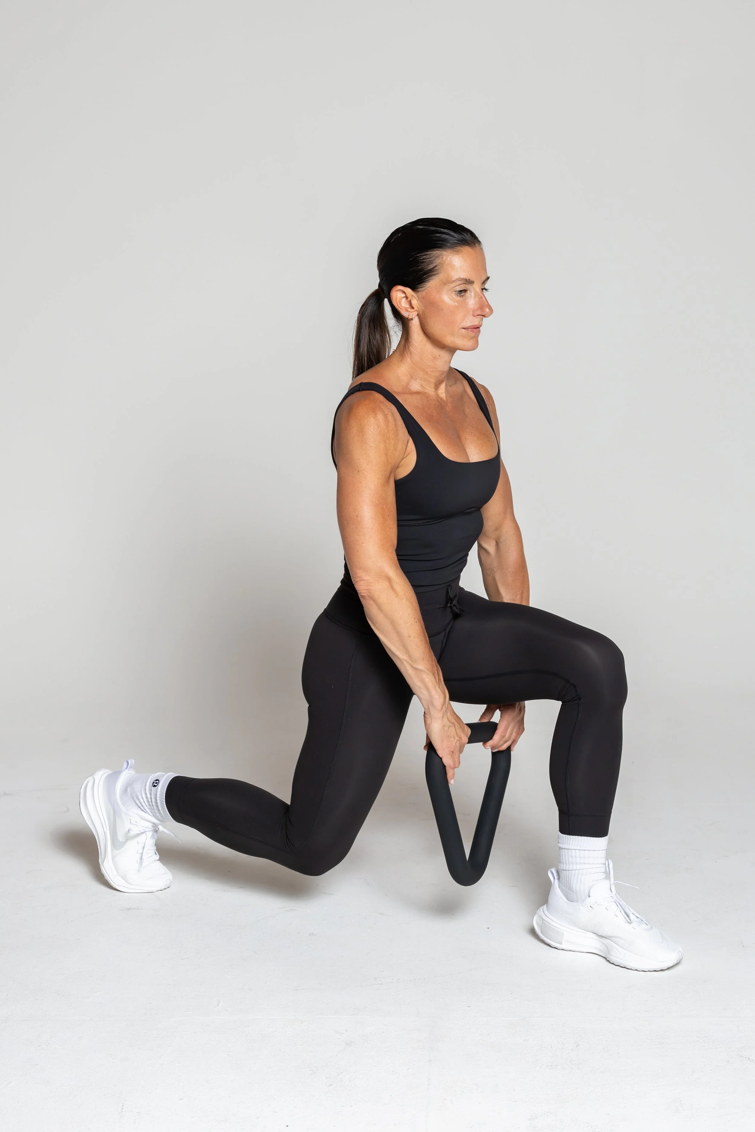 Lunge Pull through- Reverse lunge, pull tri through the legs alternate each step.