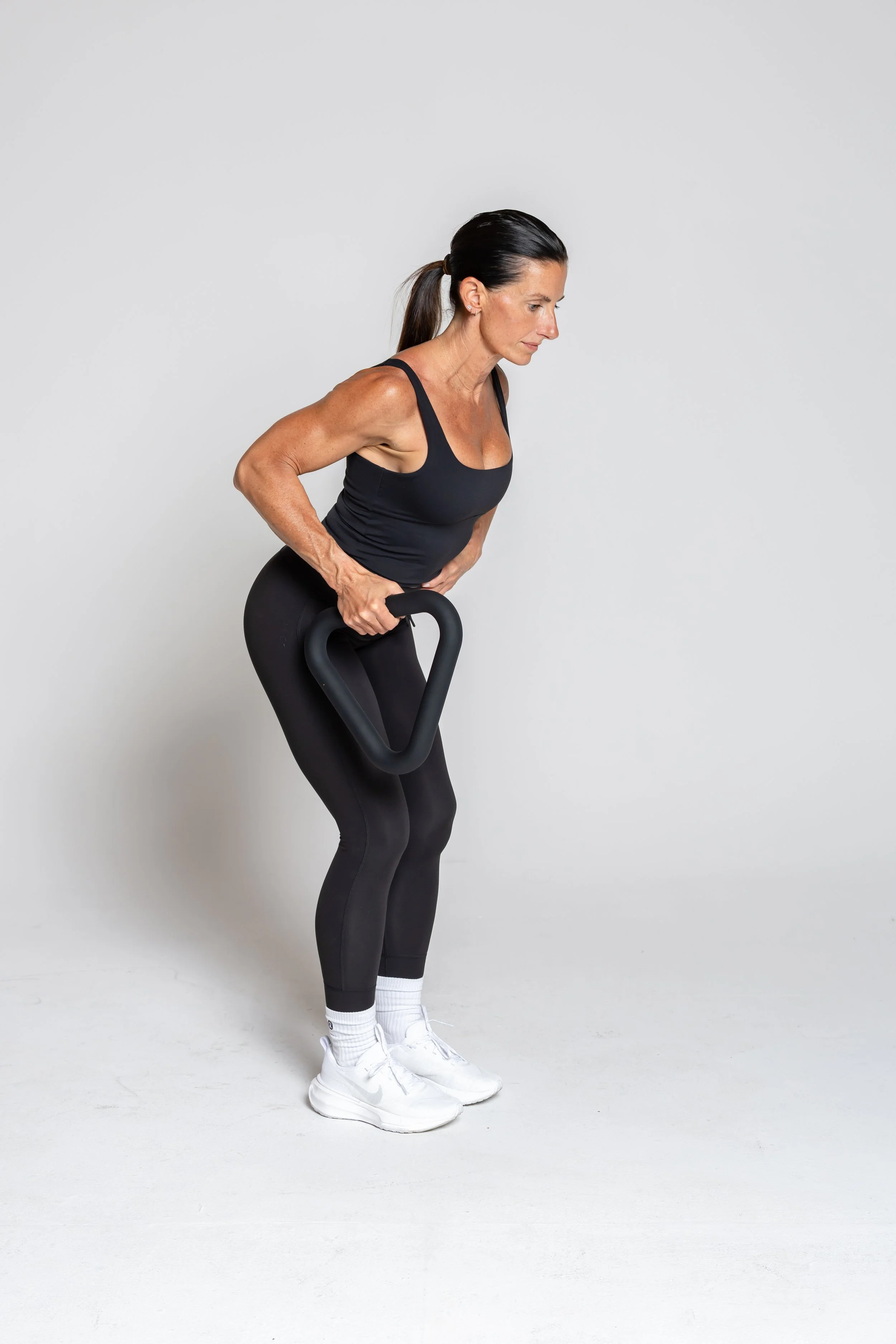 Single-Arm Row – Pull with one arm to activate your lats and core. Keep your back flat.