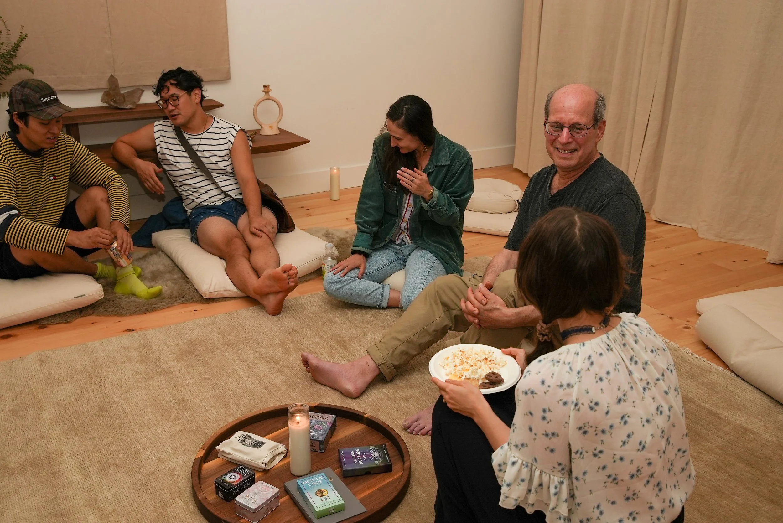 Group of people taking and laughing in a room