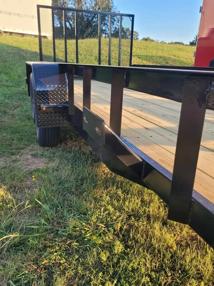 Close view of utility trailer pressure treated wood floor and steel side frame