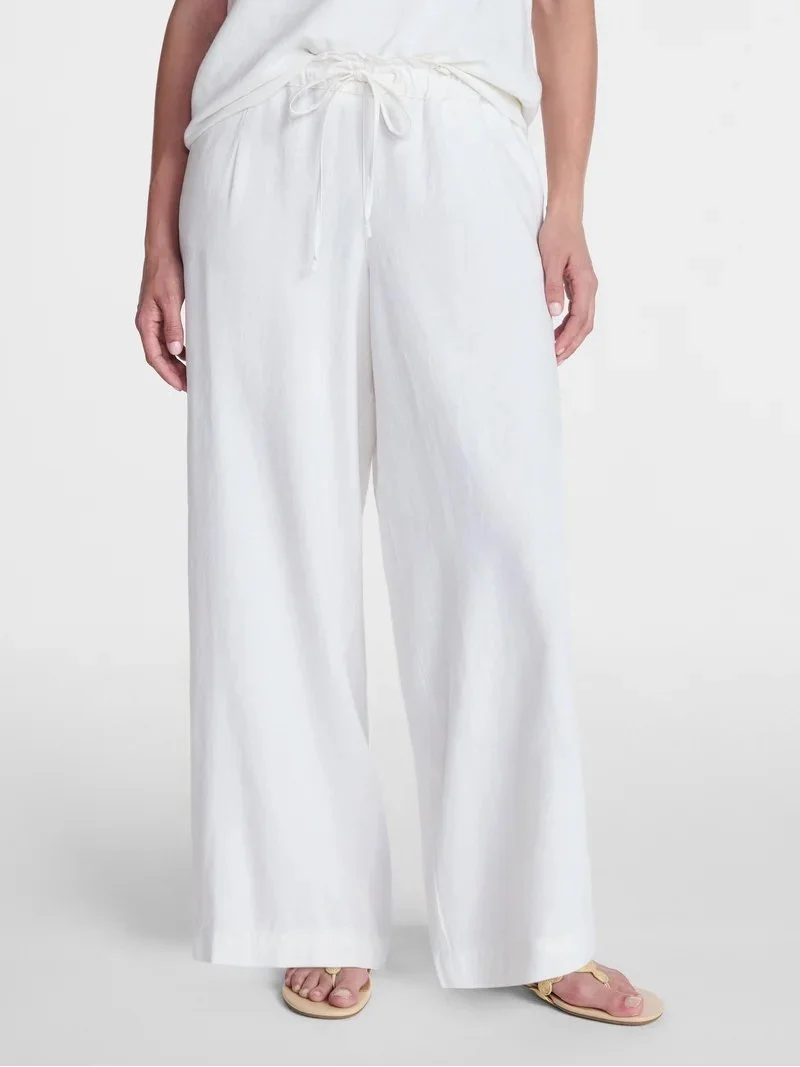 woman wearing white linen pants