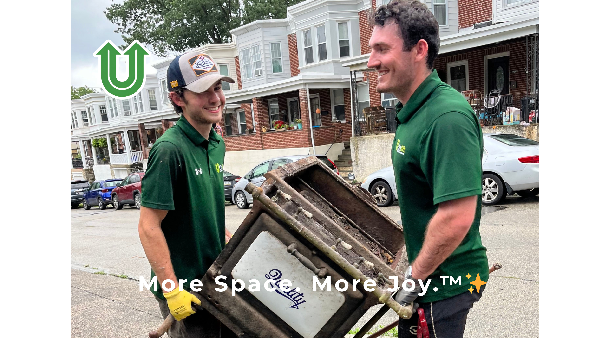 Branded photo from Uplift Junk Solutions showing a team removing an old stove from a residential home in Philadelphia. The image features the green Uplift “U” brand mark and the ‘More Space. More Joy.™ ✨’ tagline.