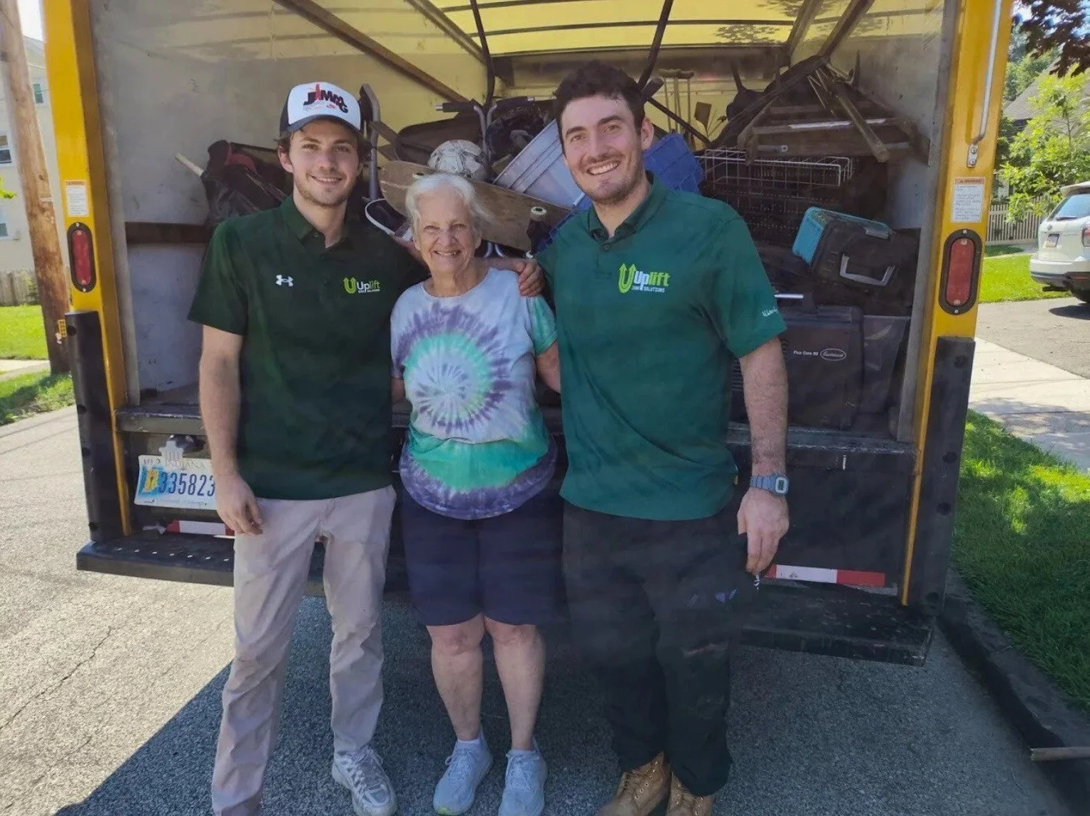 Uplift Junk Solutions founders with a satisfied client after a successful job in the Pennsylvania suburbs.