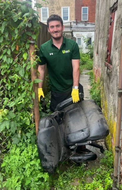 Richard, Uplift Junk Solutions founder, removing furniture from a residential property in the Pennsylvania suburbs.