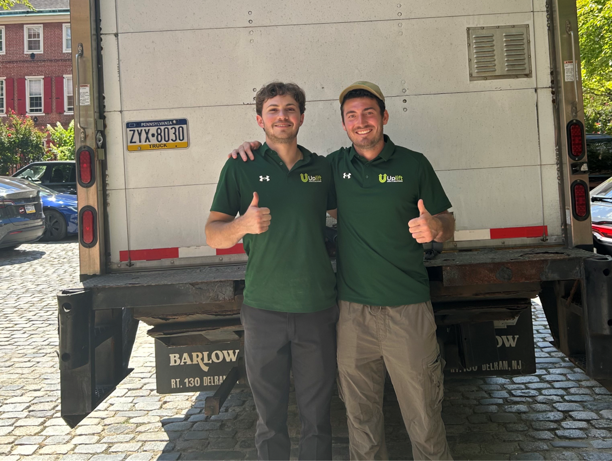 Tristan and Richard, founders of Uplift Junk Solutions, giving a thumbs up for a job well done in Center City, Philadelphia.