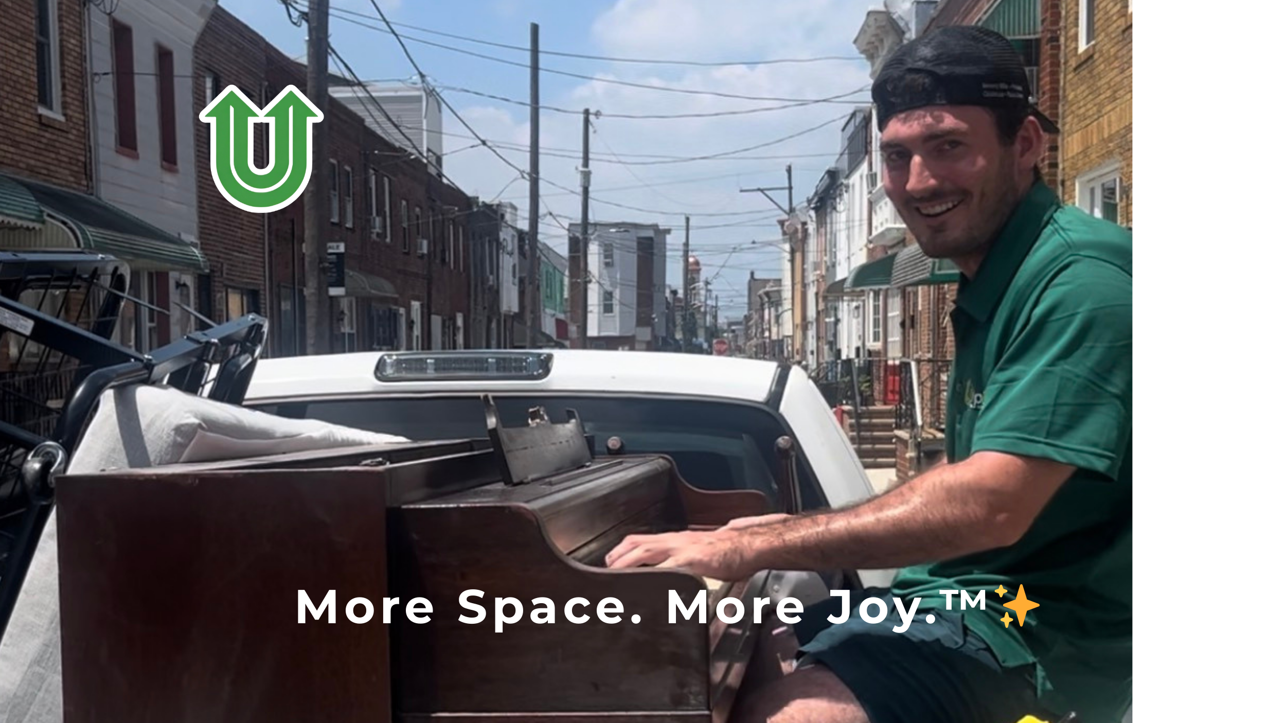 Branded photo from Uplift Junk Solutions showing a team member specializing in piano removal in South Philly. The image features the green Uplift “U” brand mark and the ‘More Space. More Joy.™ ✨’ tagline.