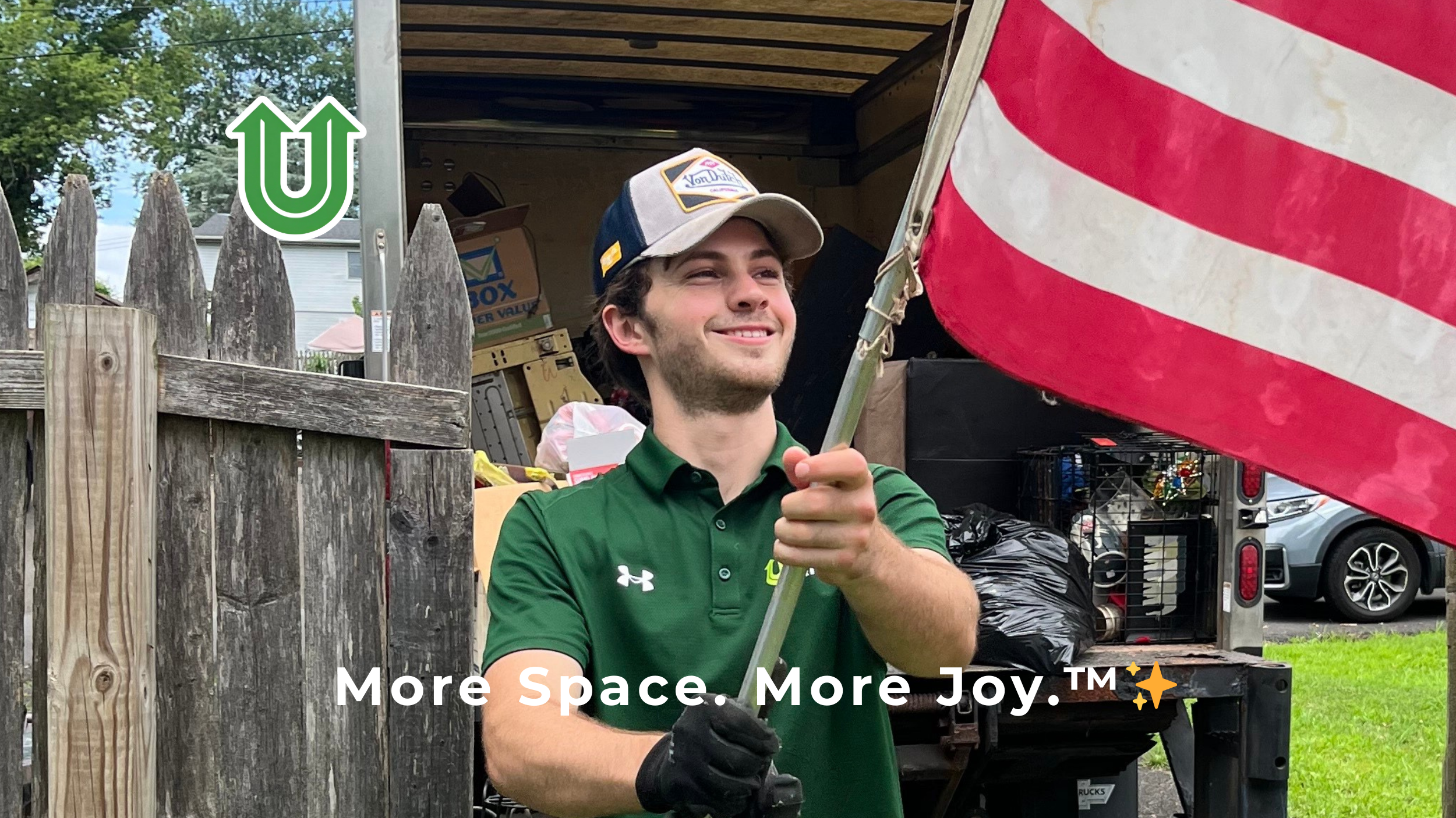 Branded photo from Uplift Junk Solutions showing a team member proud to serve residential homes in the Pennsylvania suburbs. The image features the green Uplift “U” brand mark and the ‘More Space. More Joy.™ ✨’ tagline.