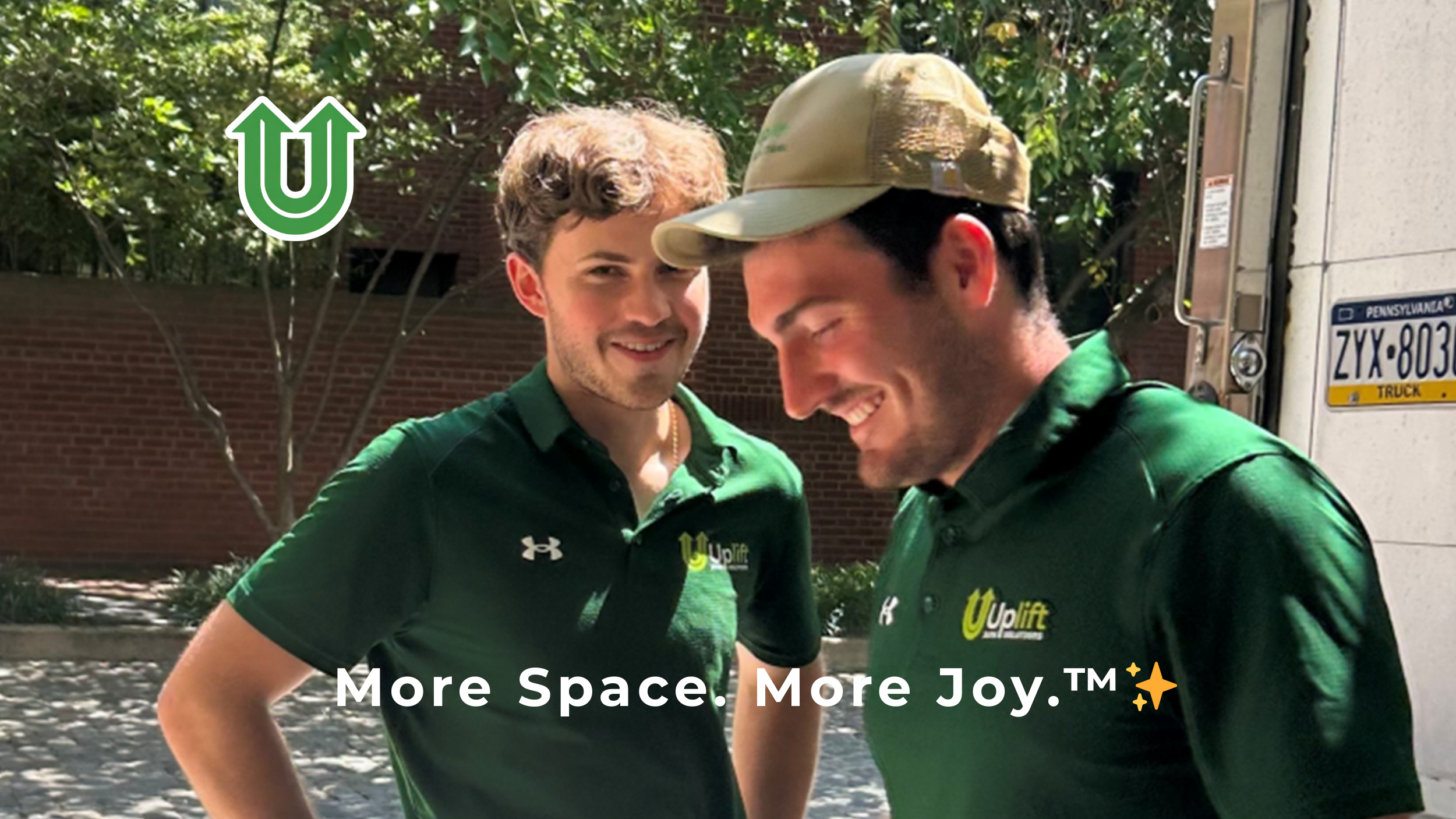 Branded photo from Uplift Junk Solutions showing founders Tristan and Richard standing outside their truck in Society Hill, Philly. The image features the green Uplift “U” brand mark and the ‘More Space. More Joy.™ ✨’ tagline.