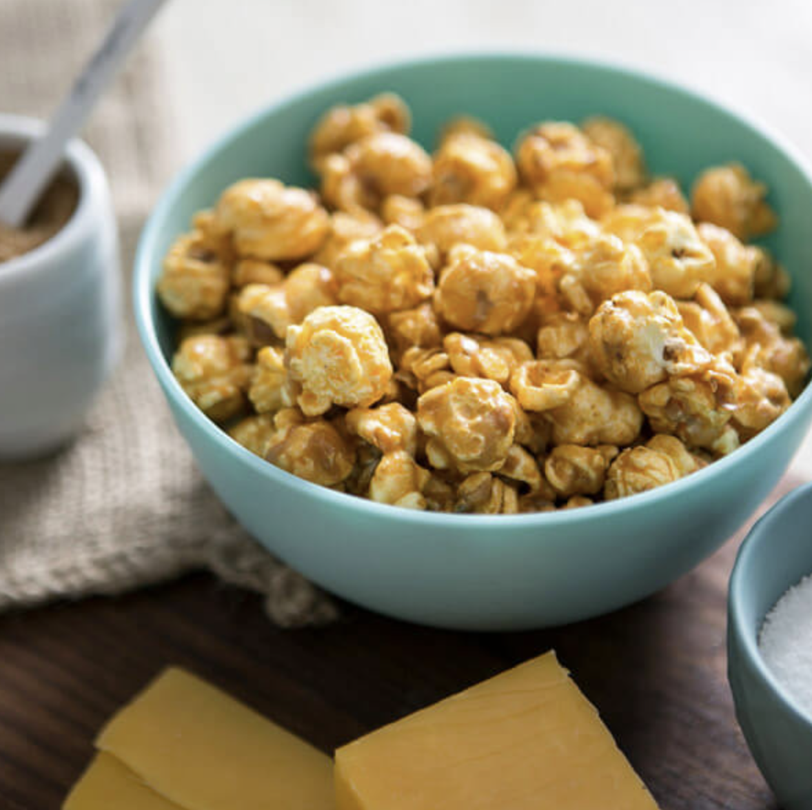 BOWL OF CHEESY CARAMEL POPCORN.png