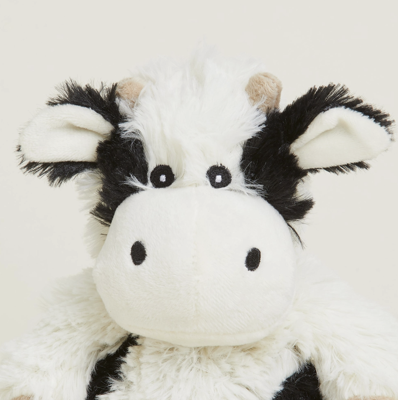 Black and White Cow Warmies Junior Up Close.png