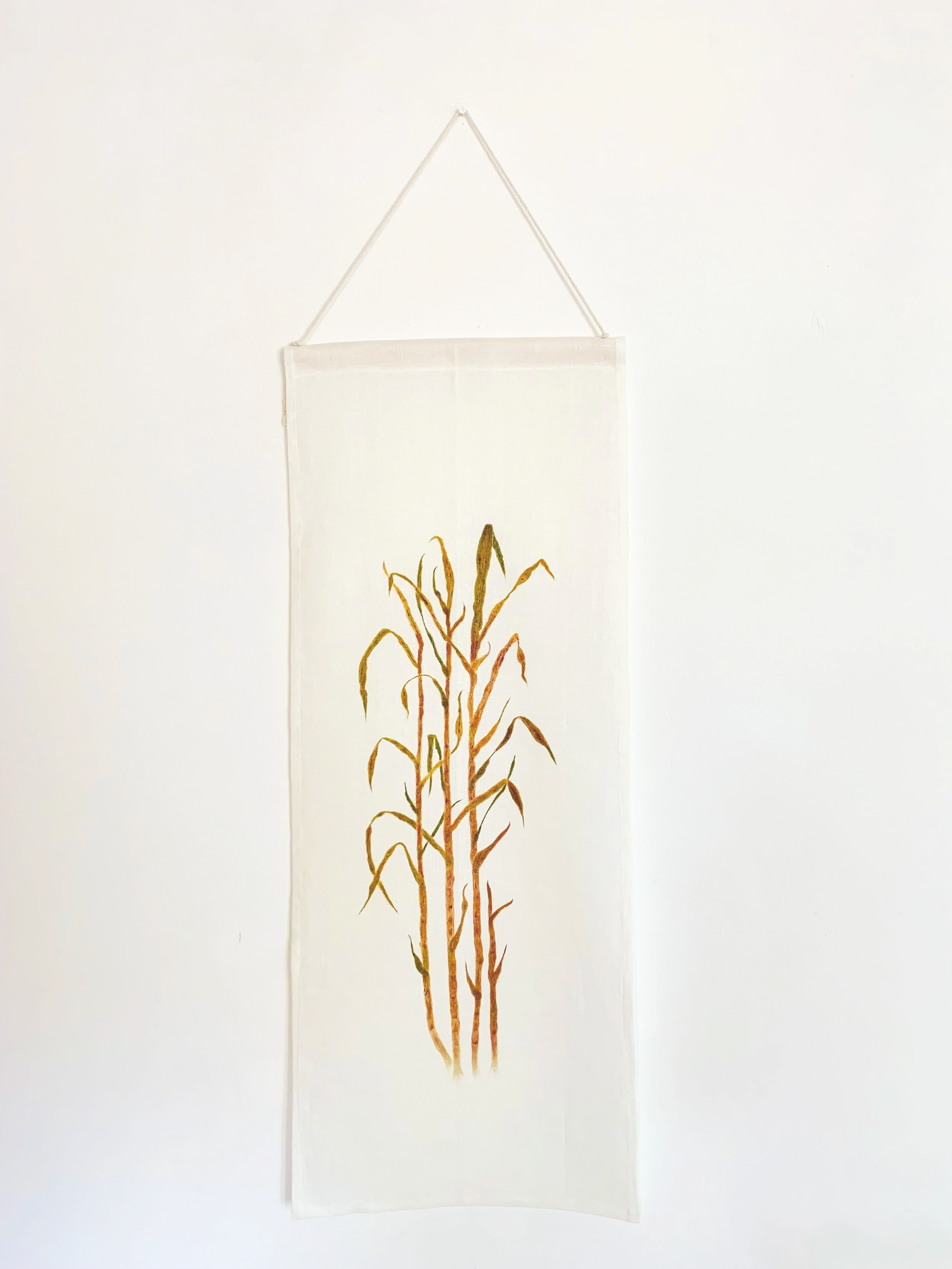 Flax linen scroll painting "Botanica Brasilis: Sugarcane I (2026)" by Cleidi Hearn. Part of the Botanica Brasilis Series depicting a purple green sugarcane plant.