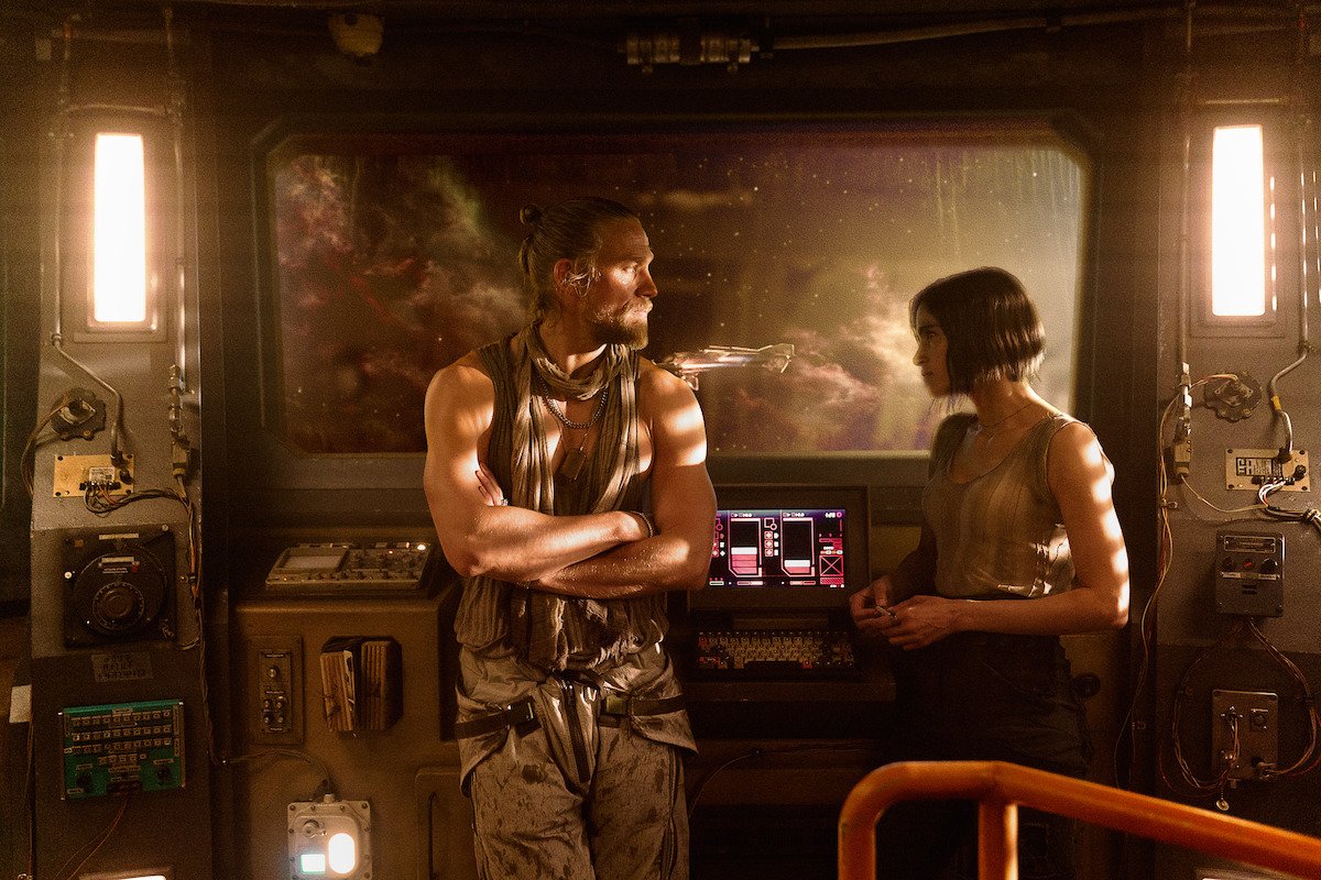 Sophia Boutella and Charlie Hunnam in Kai's Spaceship cockpit in Rebel  Moon.
.