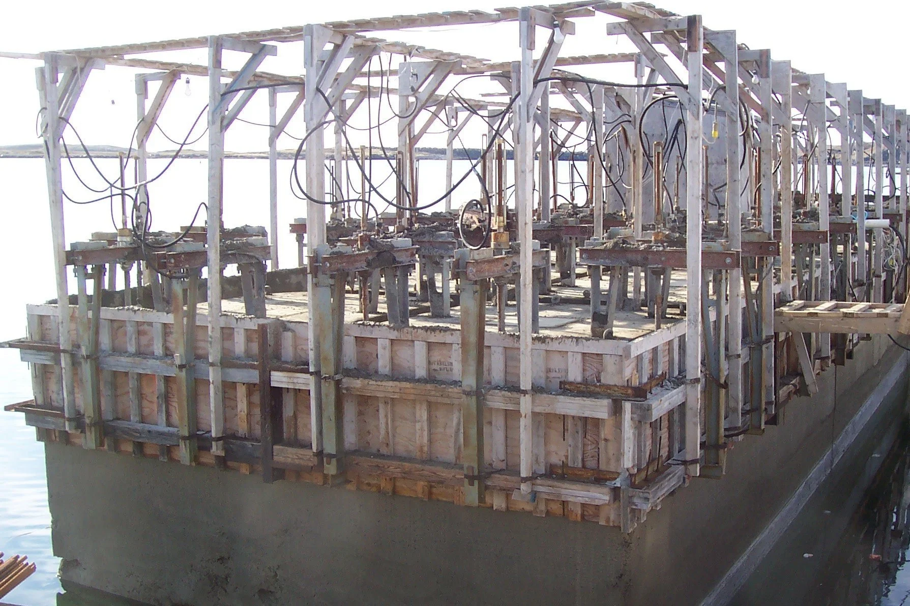 The new concrete caisson wharf, sunk into place at Port Aux Basques alternate dock viaduct.