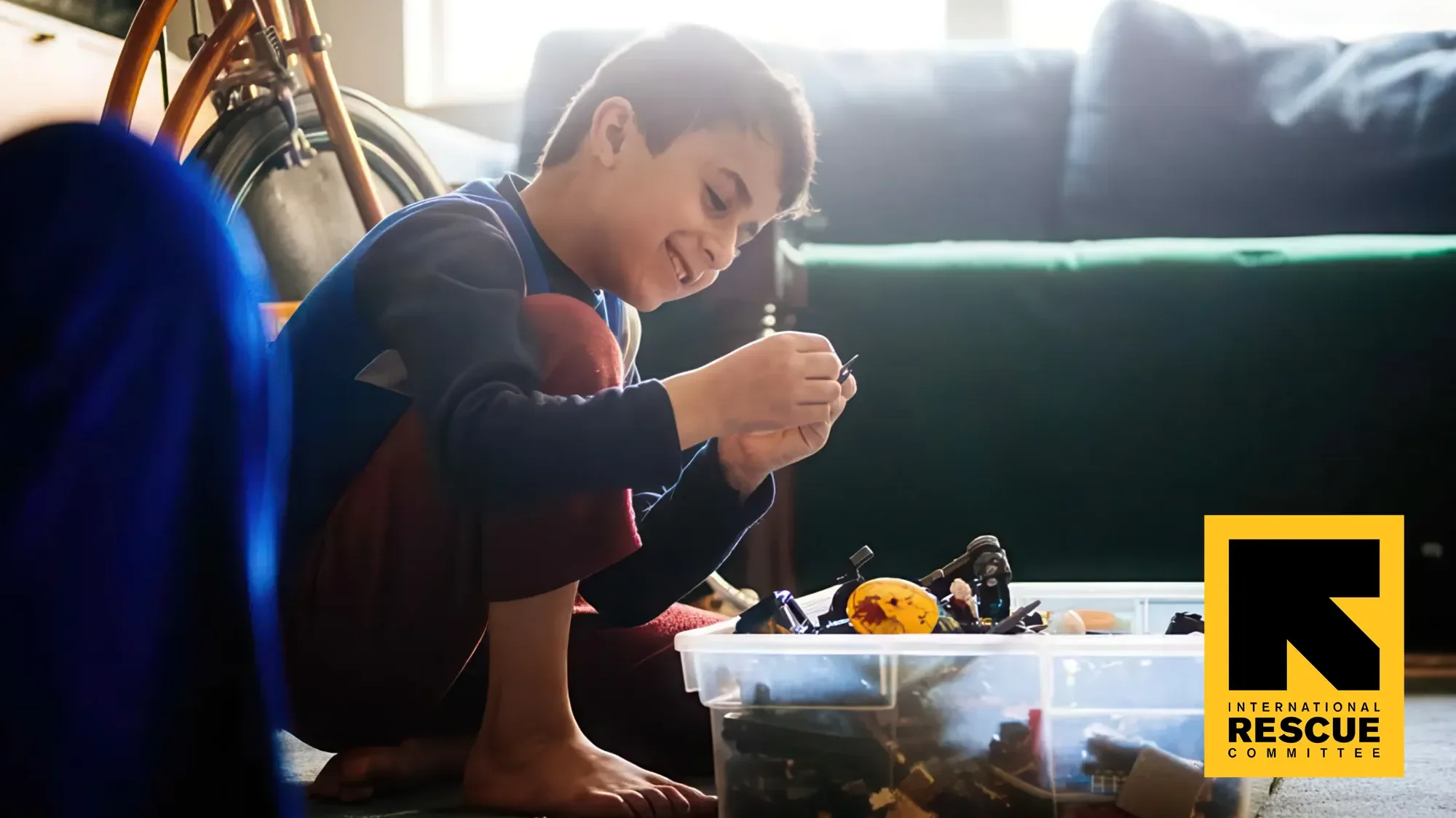 Young boy playing with mechanical devices