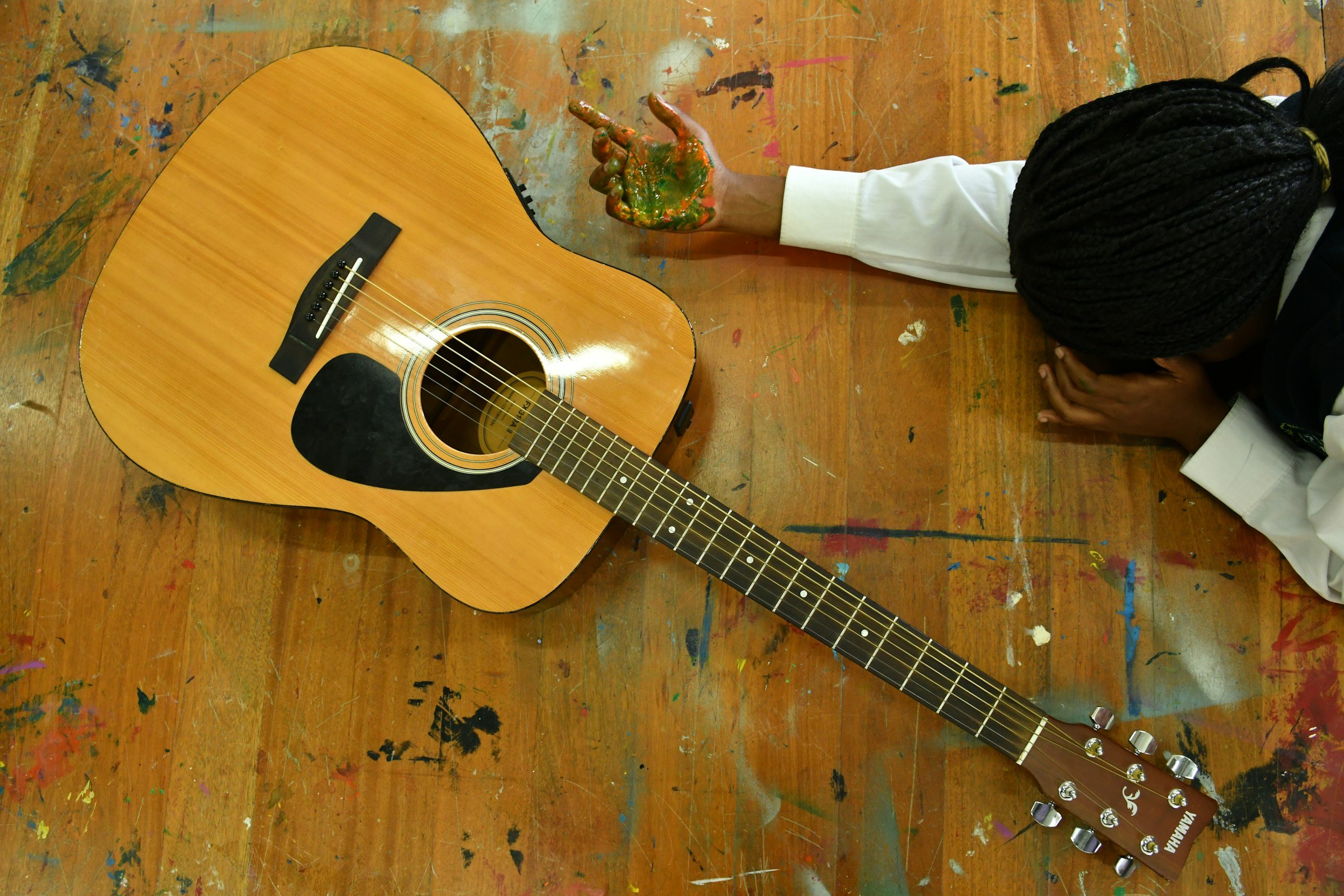 child explores instruments at after school music club in alfold surrey