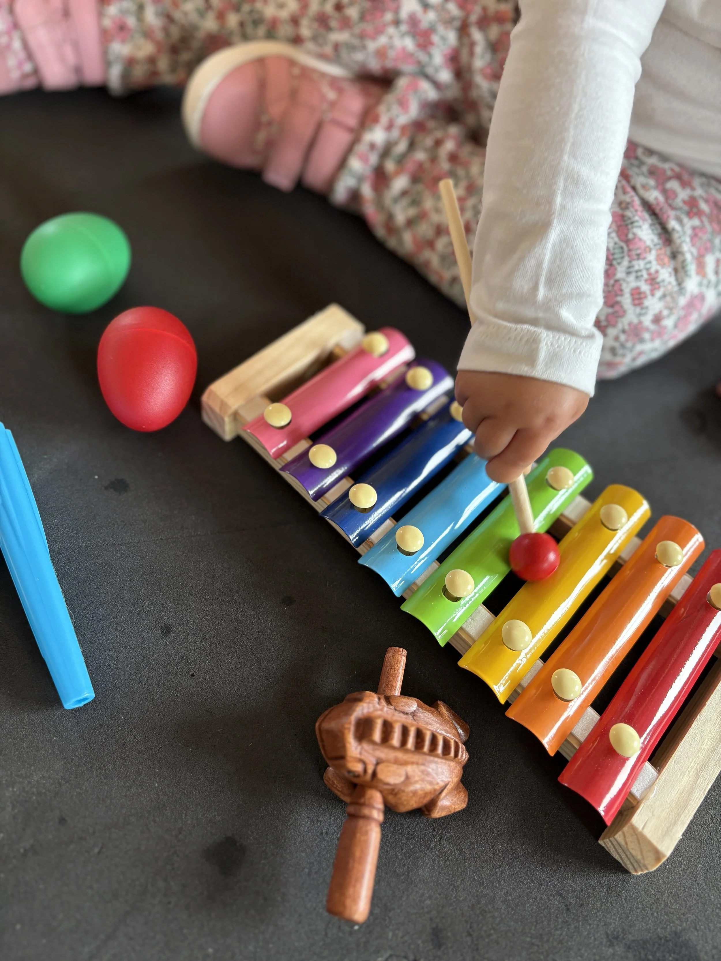 Toddler playing the xylophone in mini musicians baby, toddler and preschooler music class in Alfold, Cranleigh, Surrey