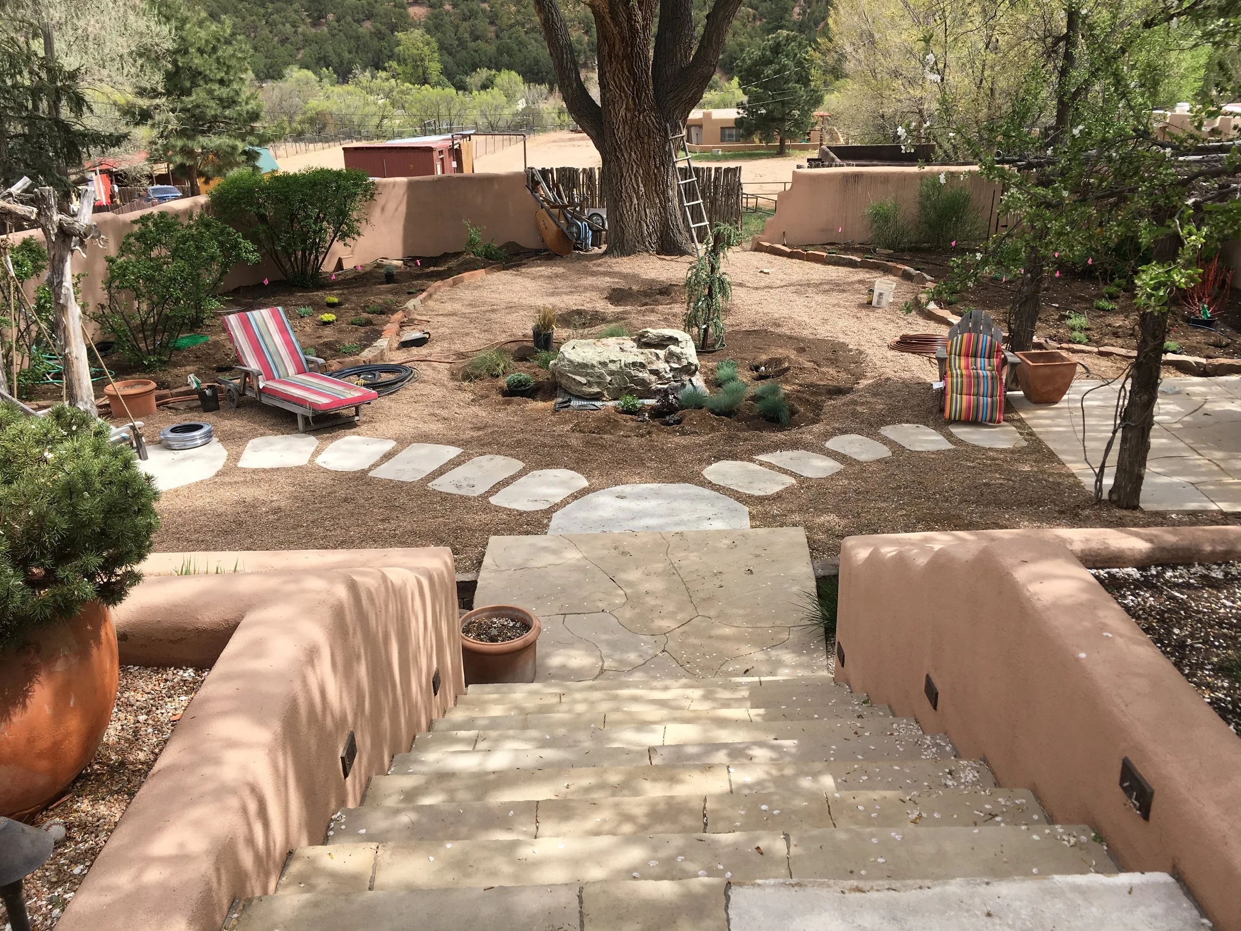 Hardscaping is in, old flagstone is cleaned up, and plants can now meet their new home!