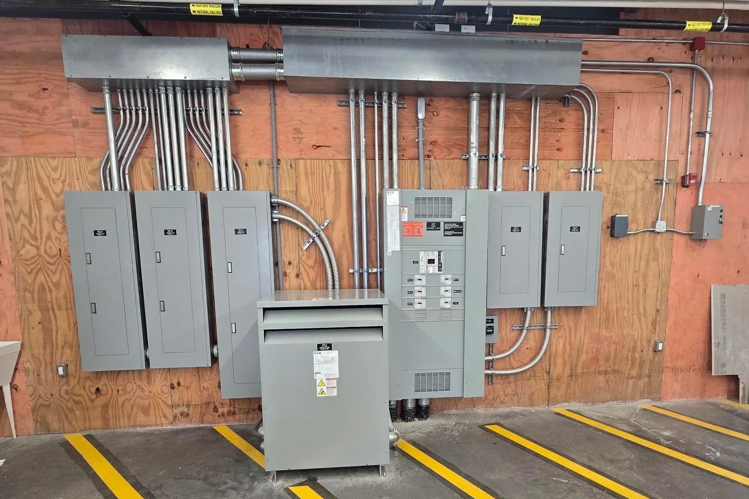 Oranssi technician working on a roof project