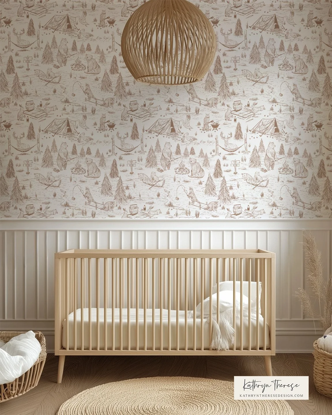 Nursery room featuring a light wood crib, beige textural rug, and a wallpaper with outdoor camping and woodland animals in gray tones. Wicker basket with blanket and pampas grass decor are also visible.