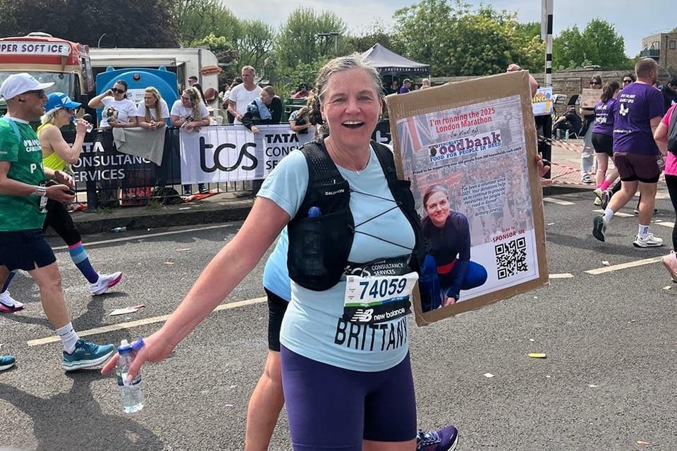 Brittany Jones with FFB poster at mile 17