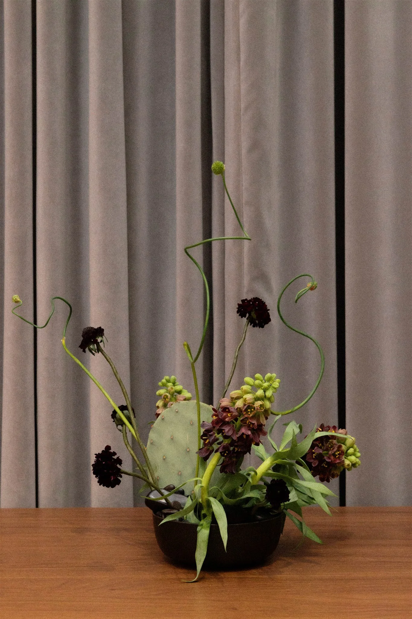 Snake Allium and frittilleria floral arrangement with cactus