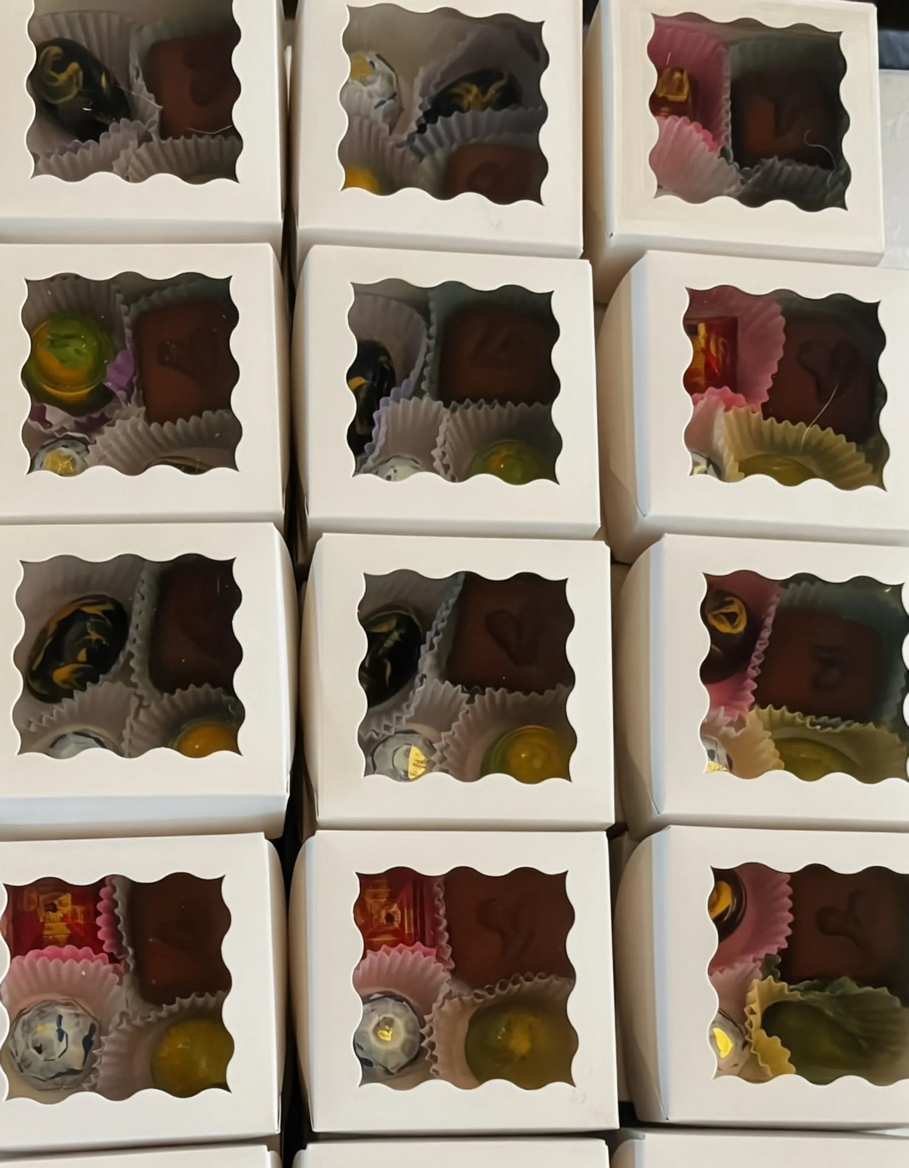 Guinevere Chocolates Close Up View Through Box Windows