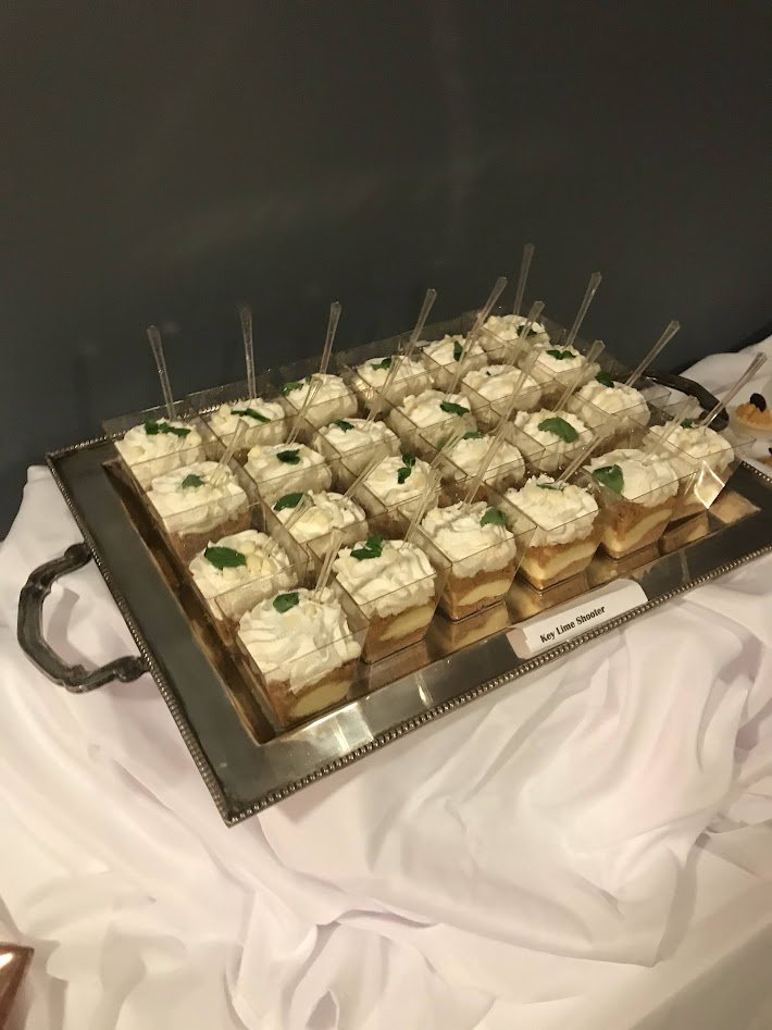 Key Lime Pie Dessert Shooters on Silver Platter on white linen