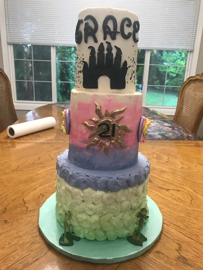 21st Birthday Celebration  Disney Theme Three Tier Cake Pipe Rosettes in Color Fade Change from Green on Bottom to Pink on Top 21 on Metallic Gold Sun Fondant Castle on Top Cake Fondant Rope Name on Cake