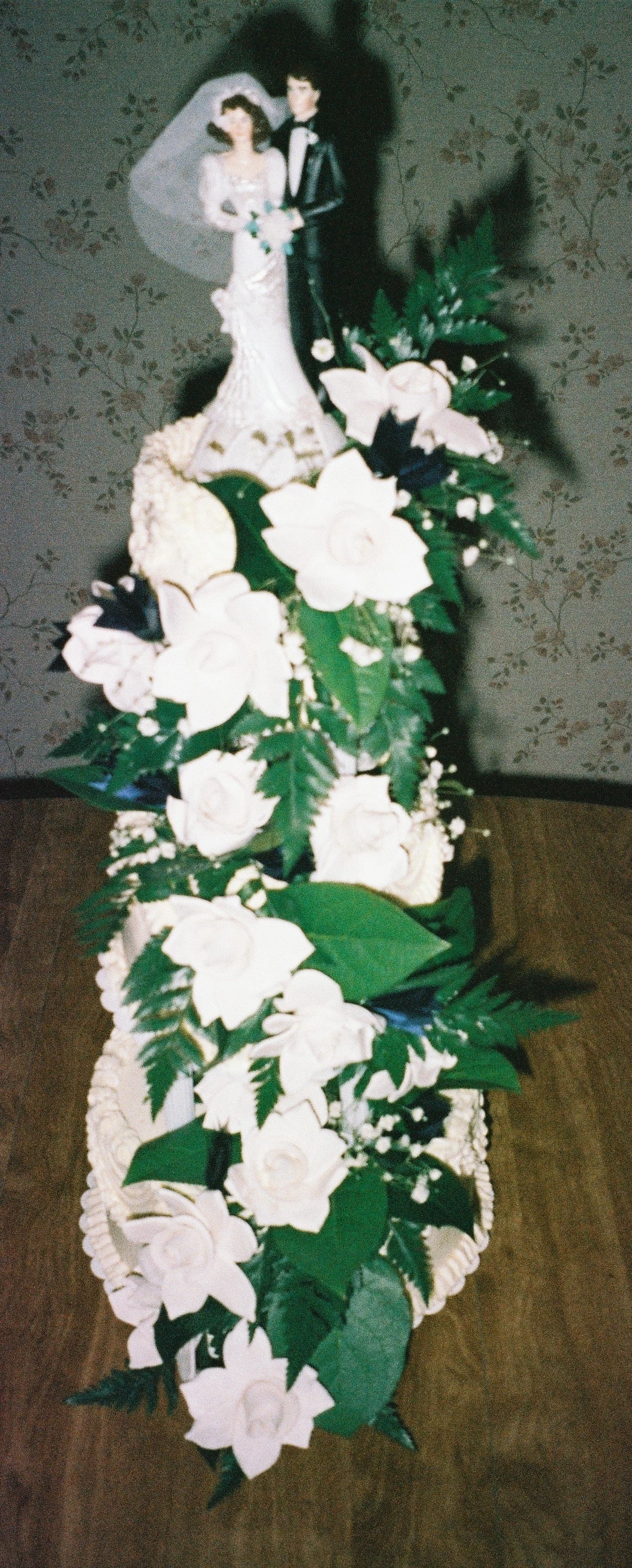 Gardenia Cascade Three Tier Tower Wedding Cake with Bride and Groom Topper