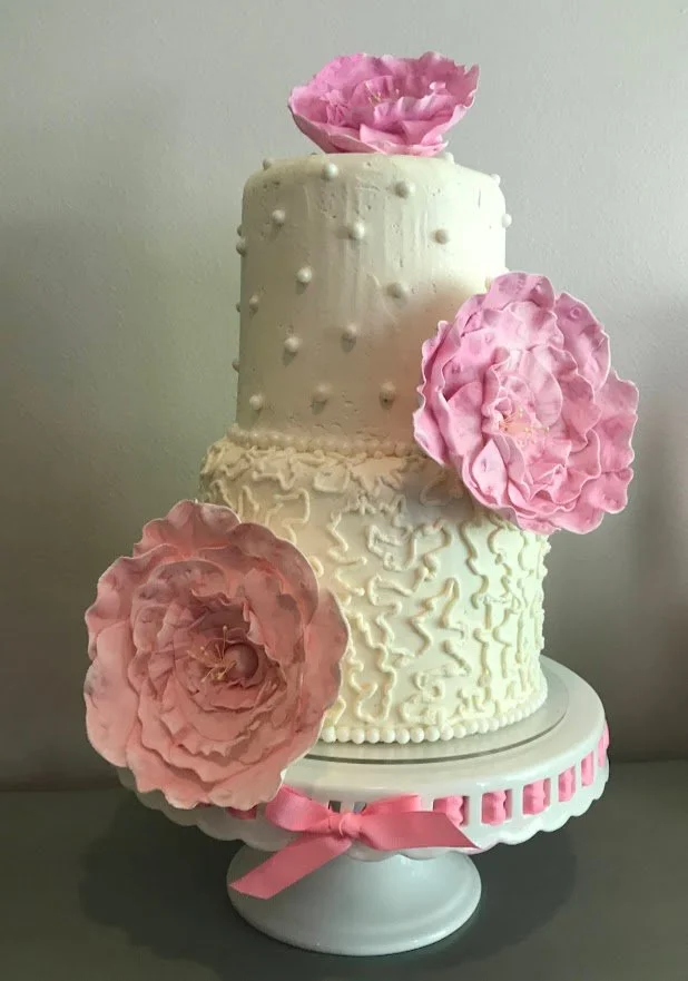 Gigantic Sugar Floribunda Flowers in Pink Two Tier Wedding Cake on Porcelain Cake Stand with Pink Ribbon