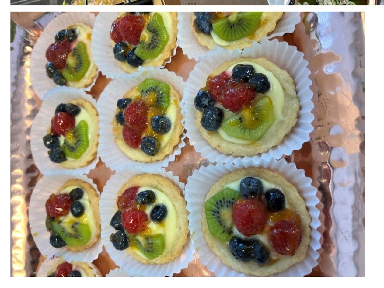 Bite Size Loose Custard Filled Tarts Topped with Fresh Raspberry Kiwi Desserts On Copper Platter